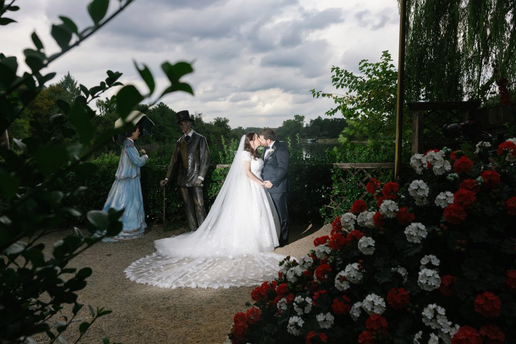 A couple on their wedding day among the sculptures at Grounds for Sculpture, Hamilton NJ