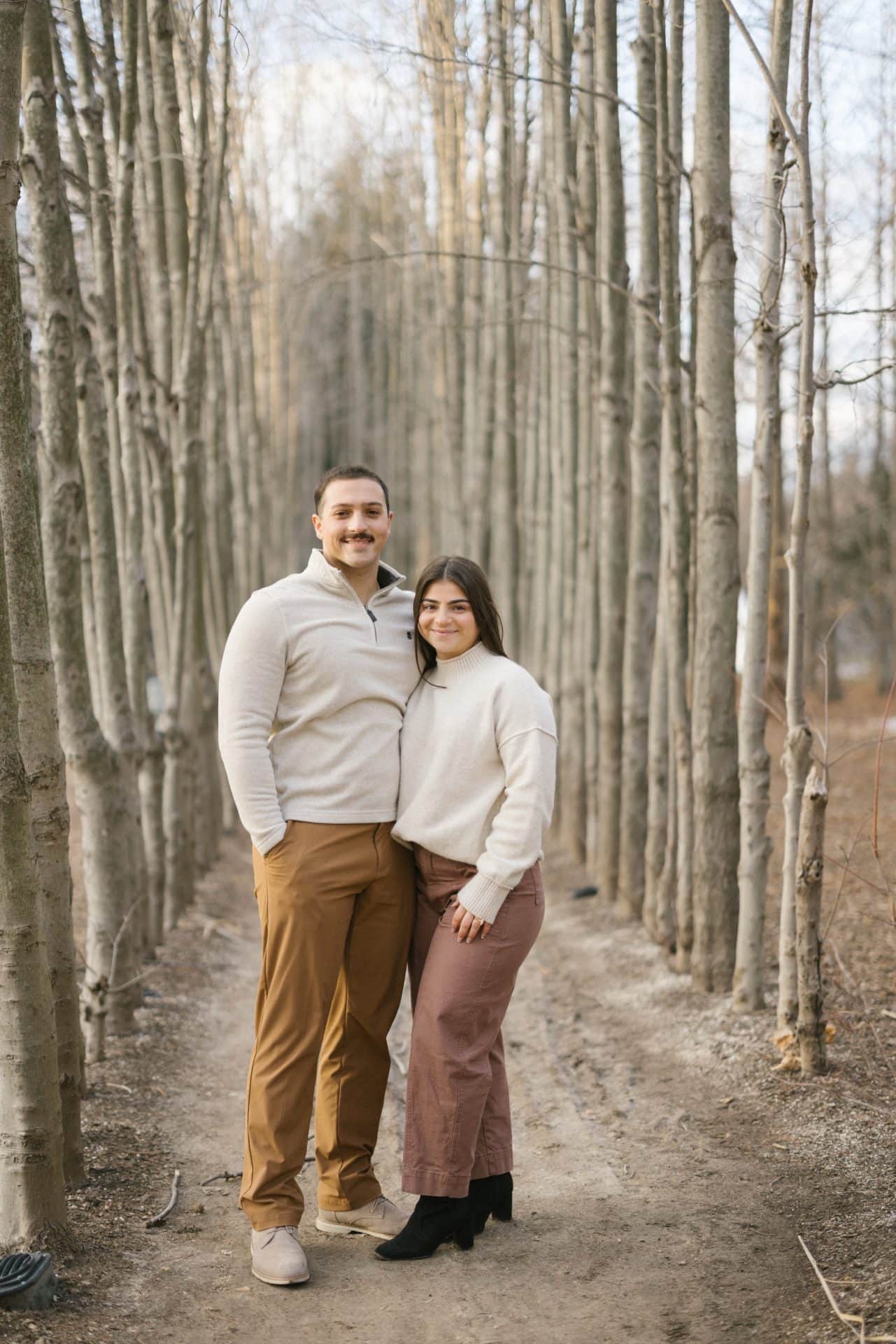 Engaged couple portrait in birch tree grove at Grounds for Sculpture Hamilton NJ winter engagement session