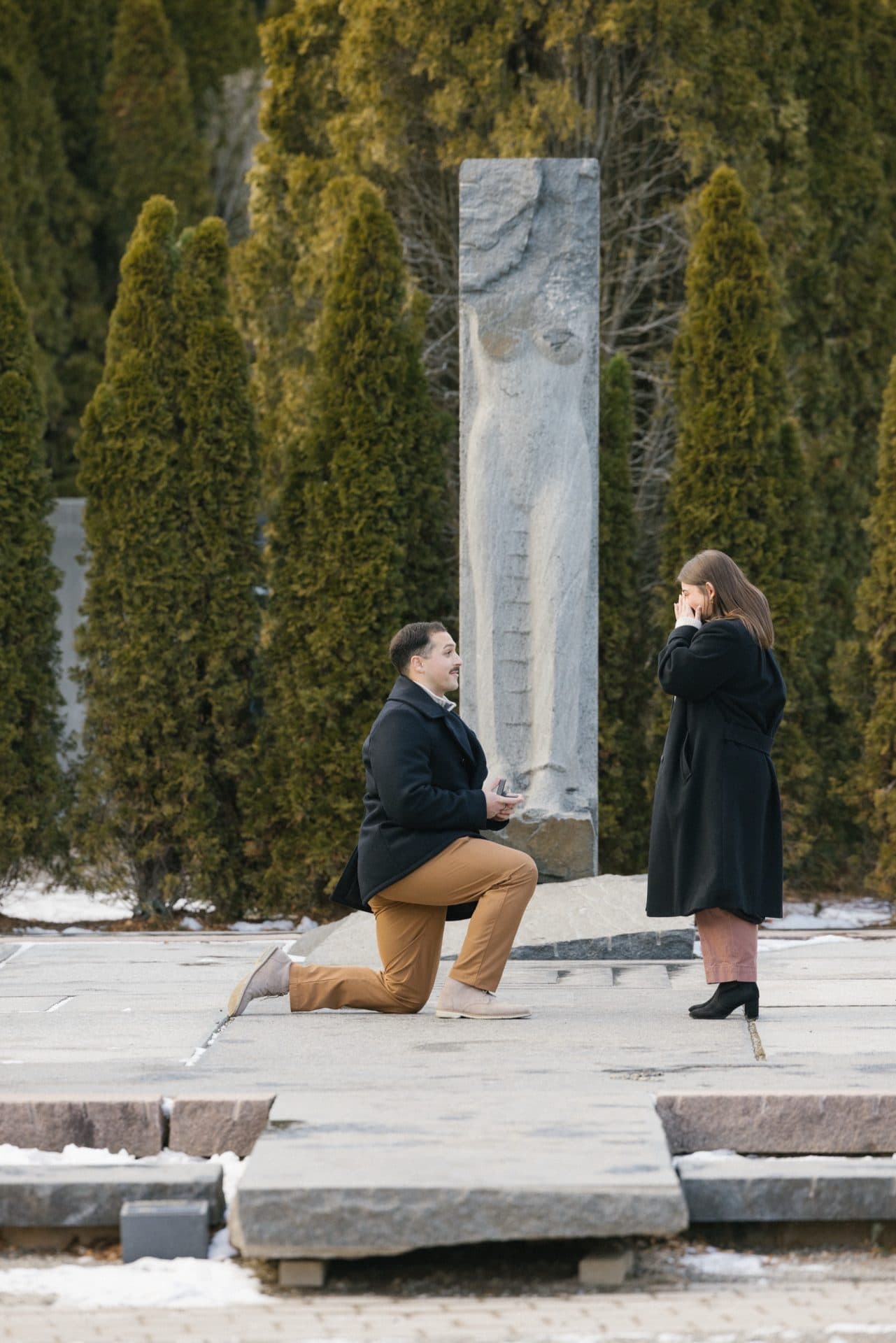 Emotional reaction during winter proposal at Nine Muses Grounds for Sculpture Hamilton NJ - NJ proposal photographer Jordan Brian Studios