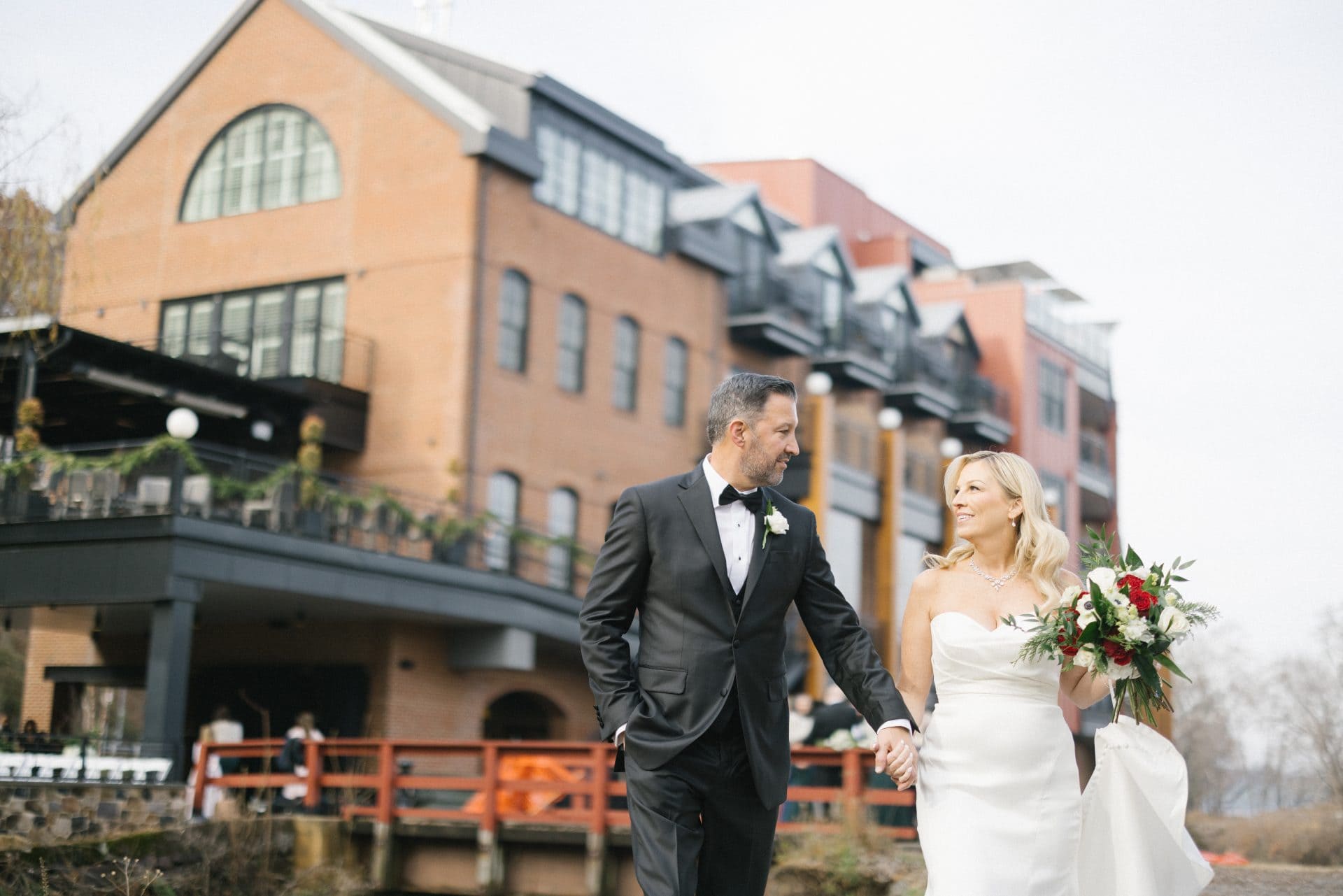 Couple portrait along the Delaware River at golden hour at River House at Odette's in New Hope PA