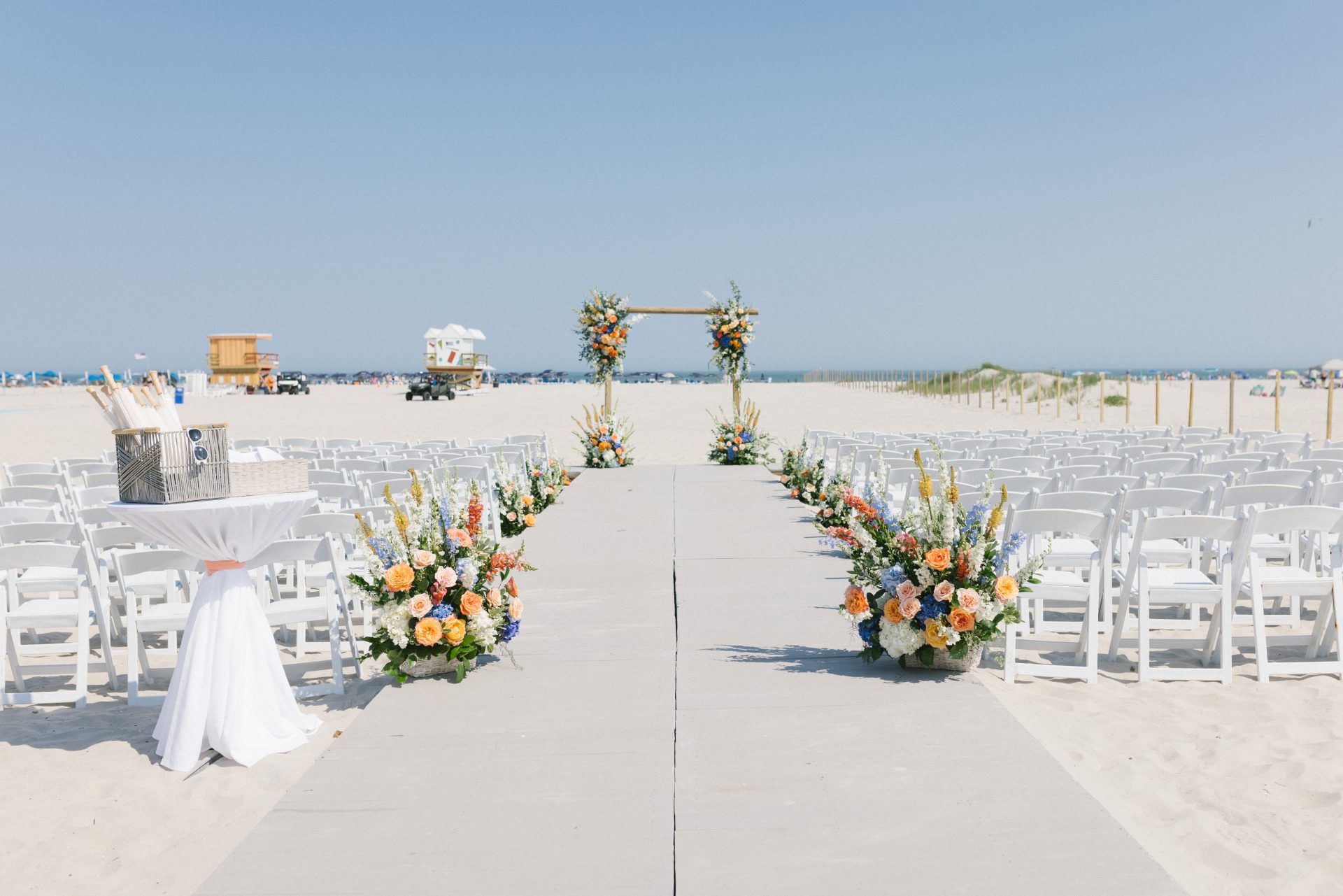 Colorful floral aisle setup for beachside walkway ceremony at ICONA Diamond Beach Wildwood NJ
