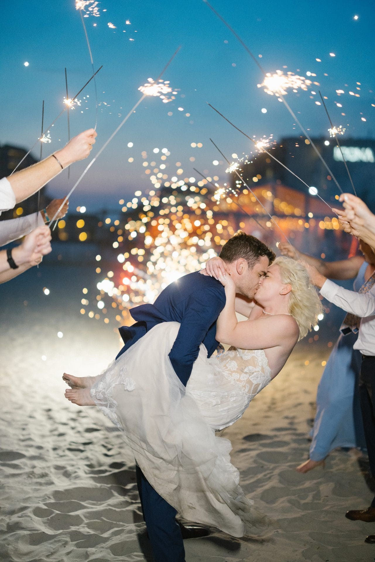 Sparkler dip kiss on the beach at sunset at ICONA Diamond Beach Wildwood NJ