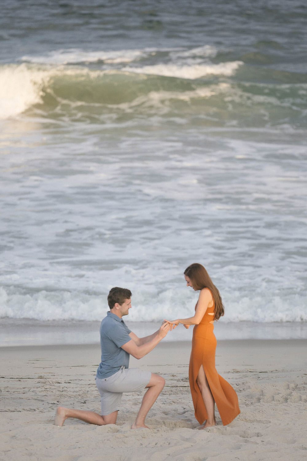 Long Beach Island beach proposal - groom on one knee with ocean waves