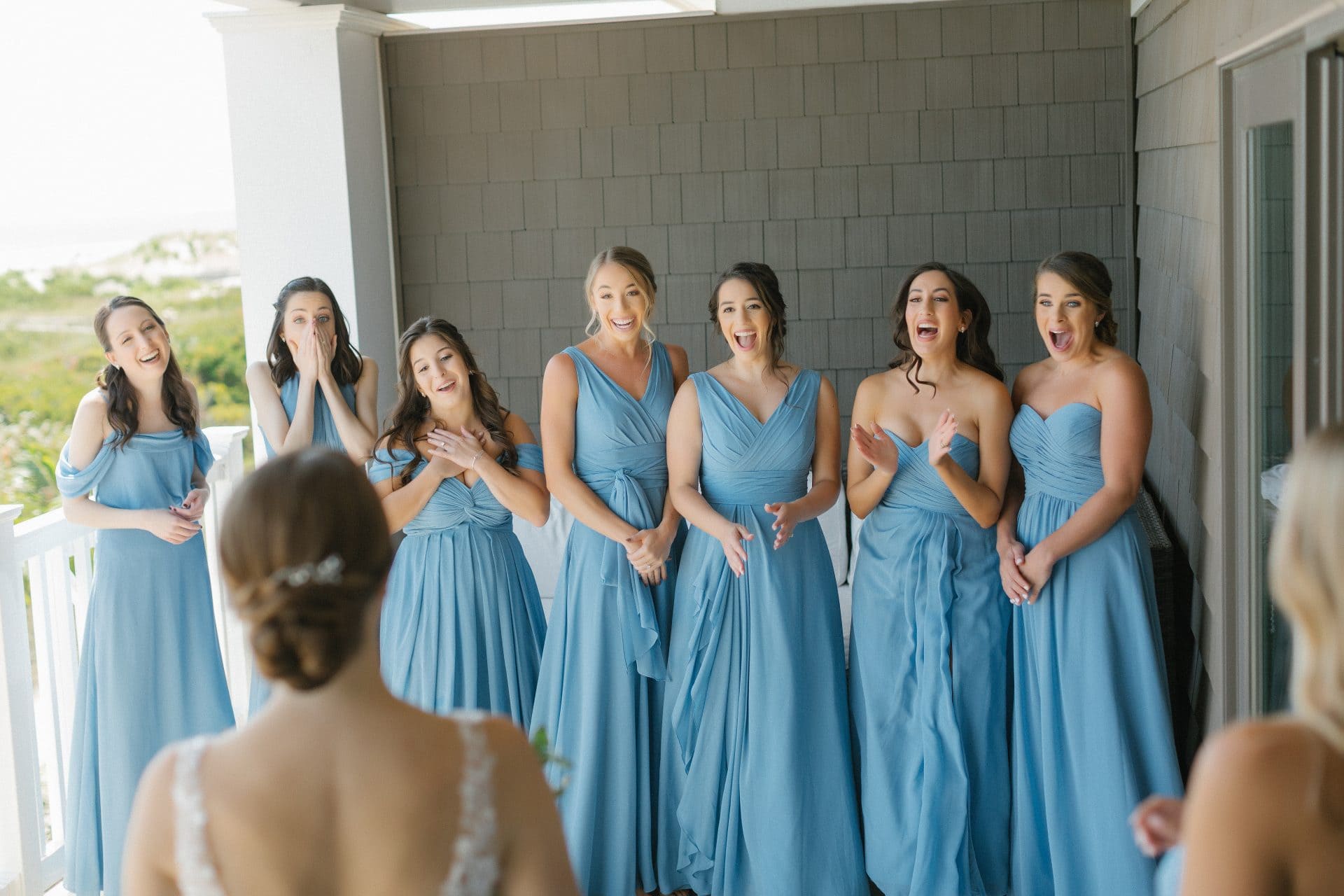 Bridesmaids' first reaction together on the ocean-view balcony at ICONA Avalon in Avalon NJ