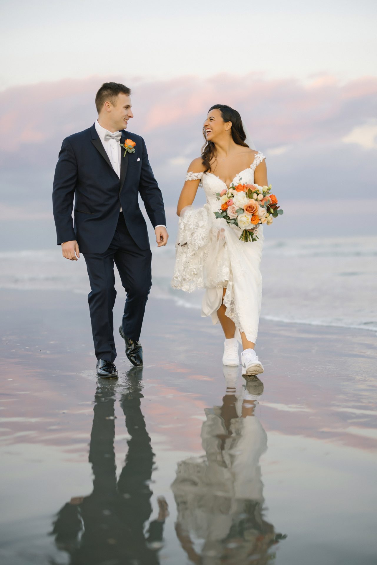 Couple golden hour portrait on the beach at ICONA Avalon in Avalon NJ