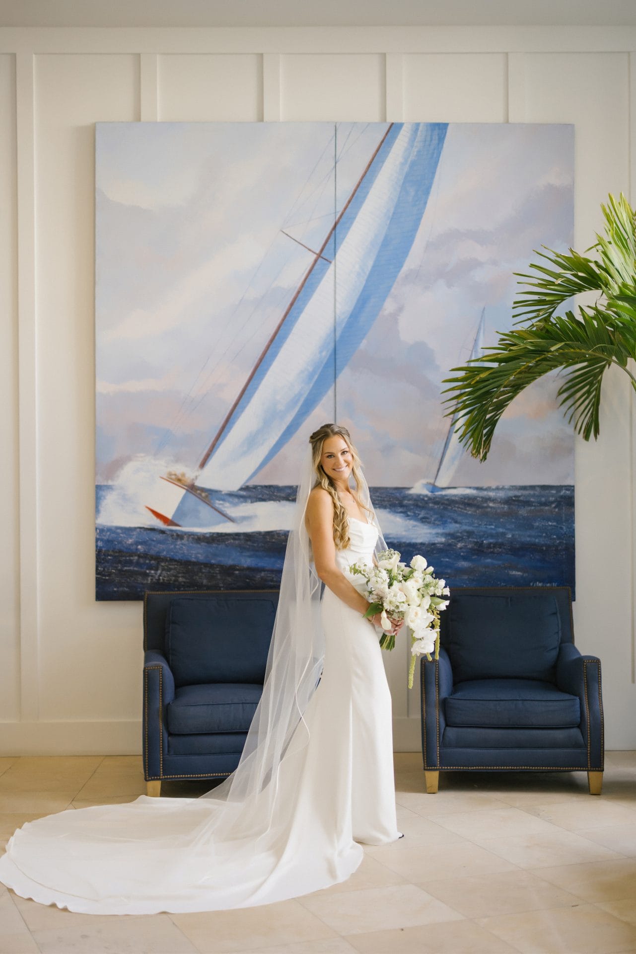 Couple portrait at the sailboat painting wall at ICONA Avalon in Avalon NJ