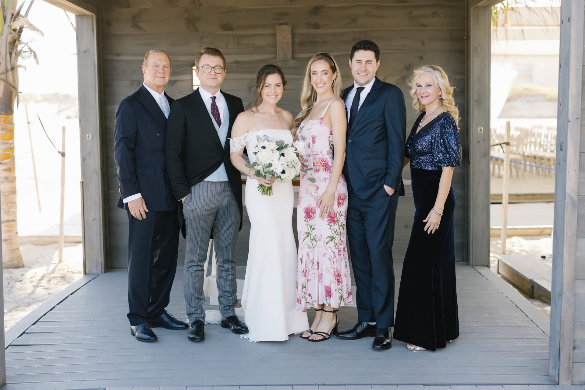 Family formals in the covered beach bungalow at ICONA Diamond Beach Wildwood NJ