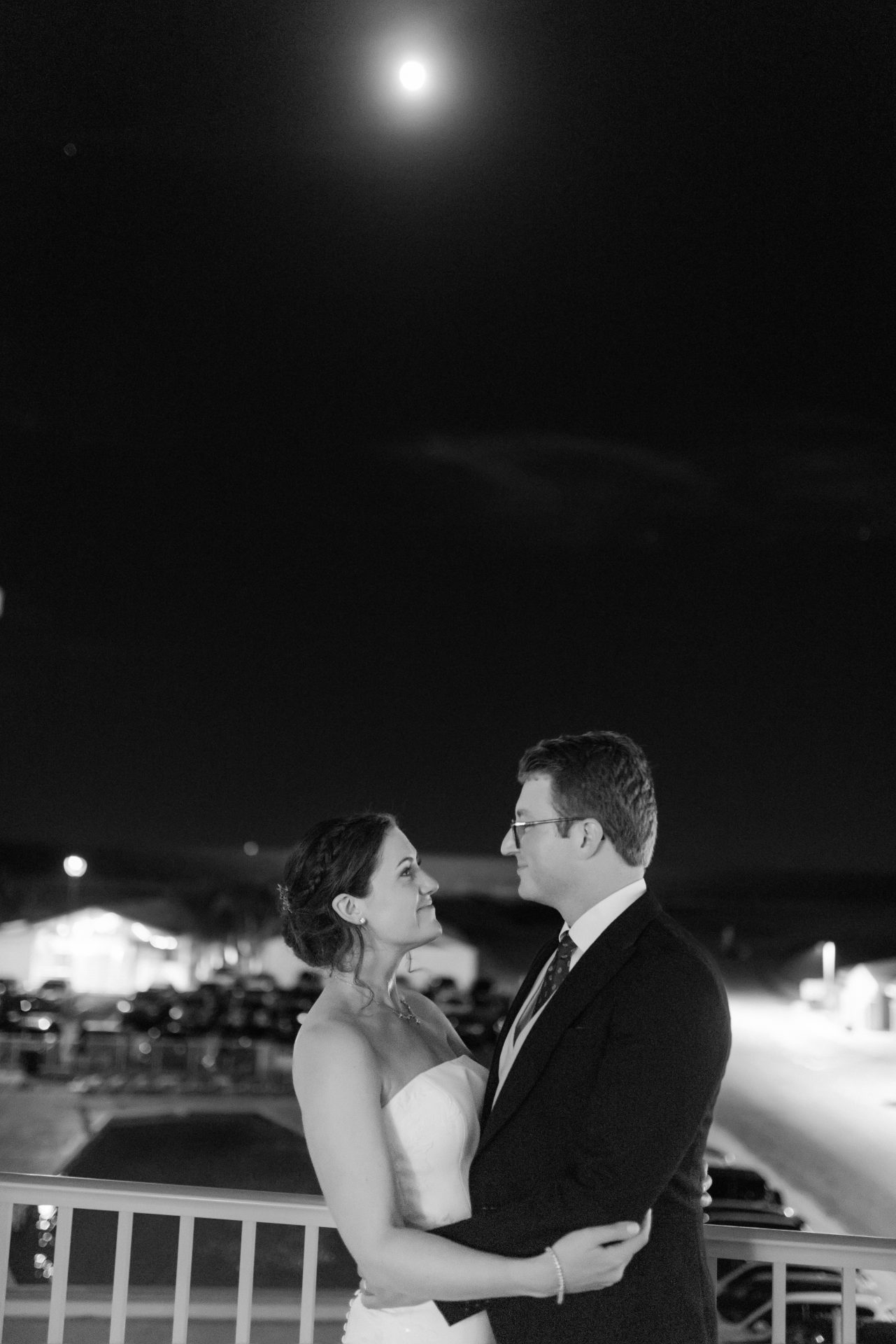 Couple on the ballroom balcony under the full moon at ICONA Diamond Beach Wildwood NJ