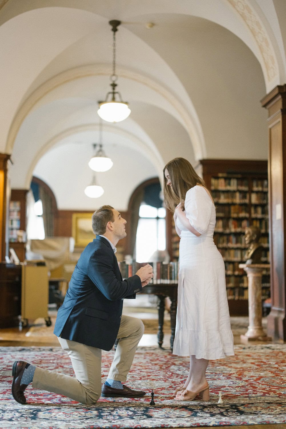 Union League Philadelphia surprise proposal - groom on one knee in library