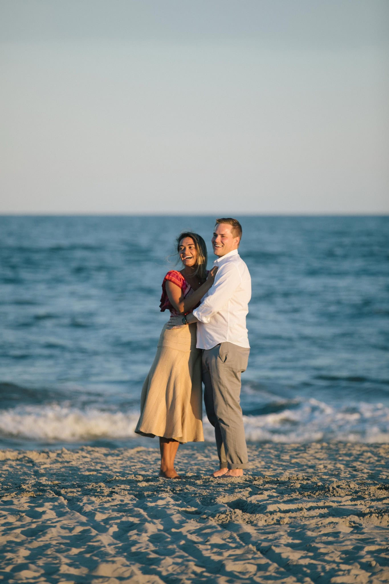 Family surprising newly engaged couple on Sea Isle City beach after proposal