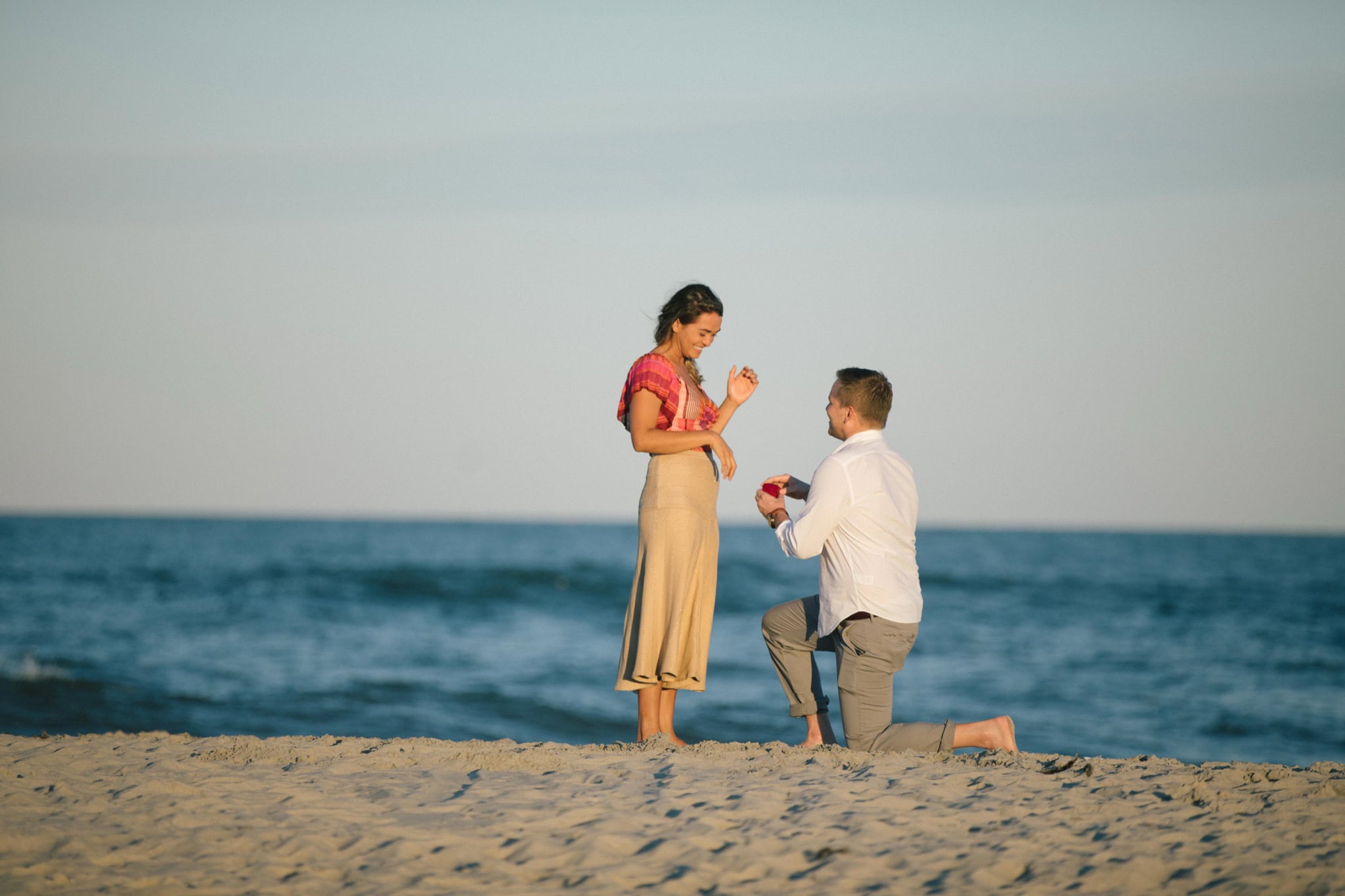 Sea Isle City beach proposal setup with golden hour light on the Jersey Shore in New Jersey