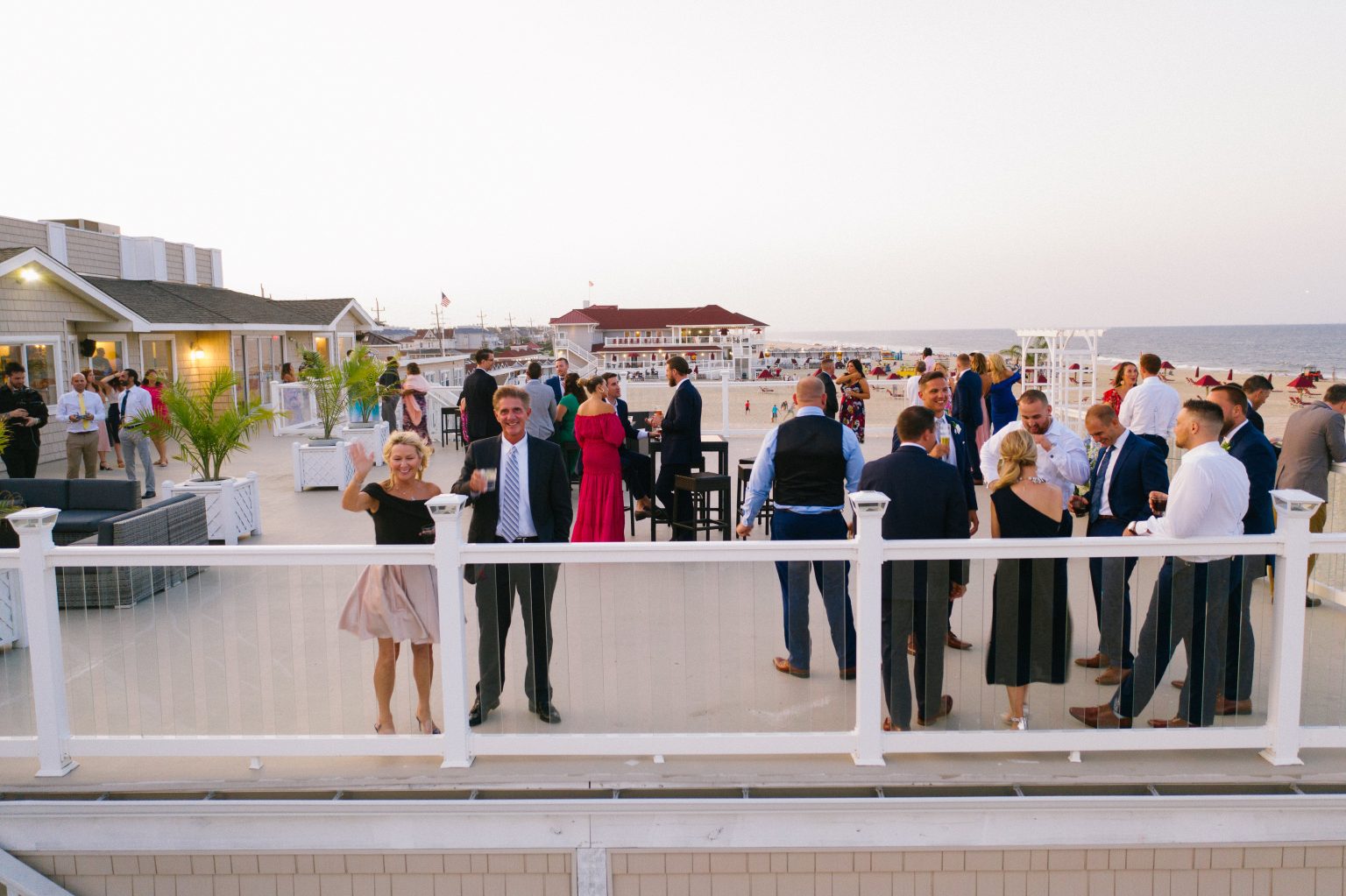 Bride and groom on the deck overlooking the water at Windows on the Water, Sea Bright NJ