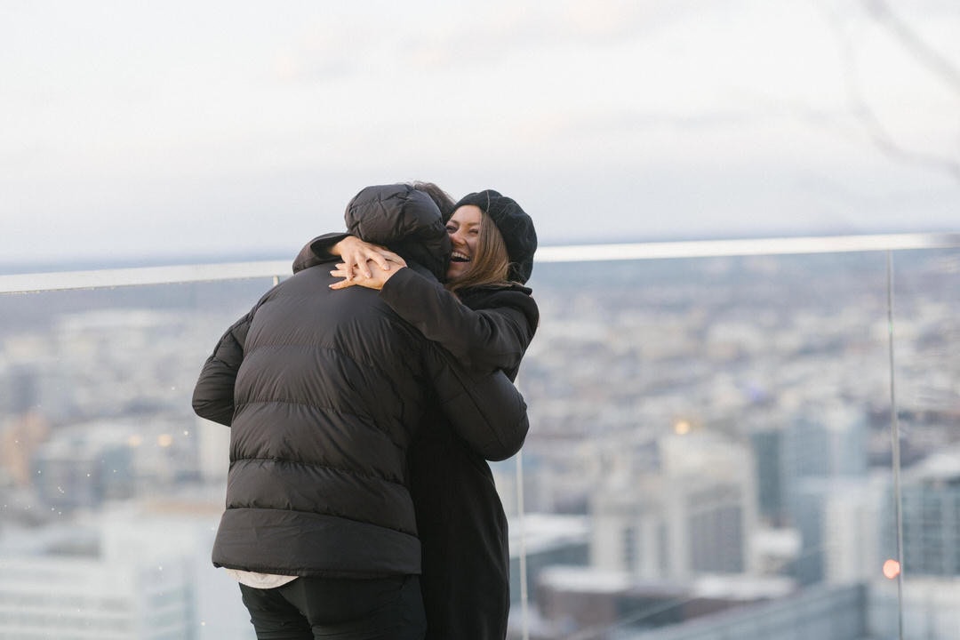 Engagement portrait of Matt Wolff and Kim Lloyd on the W Hotel Philadelphia rooftop overlooking the city