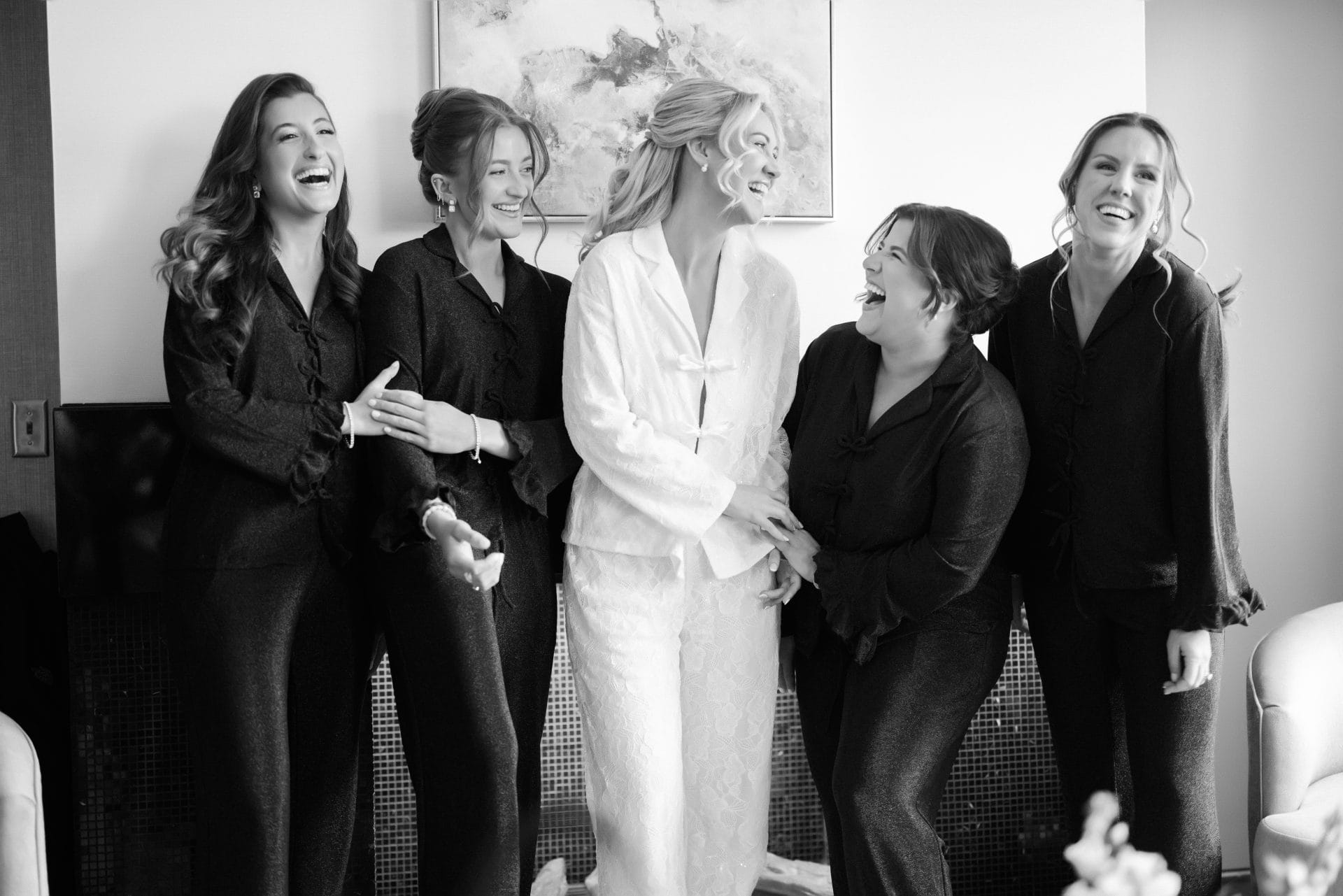 Candid bridal party moment in hotel suite before Ballroom at the Ben wedding