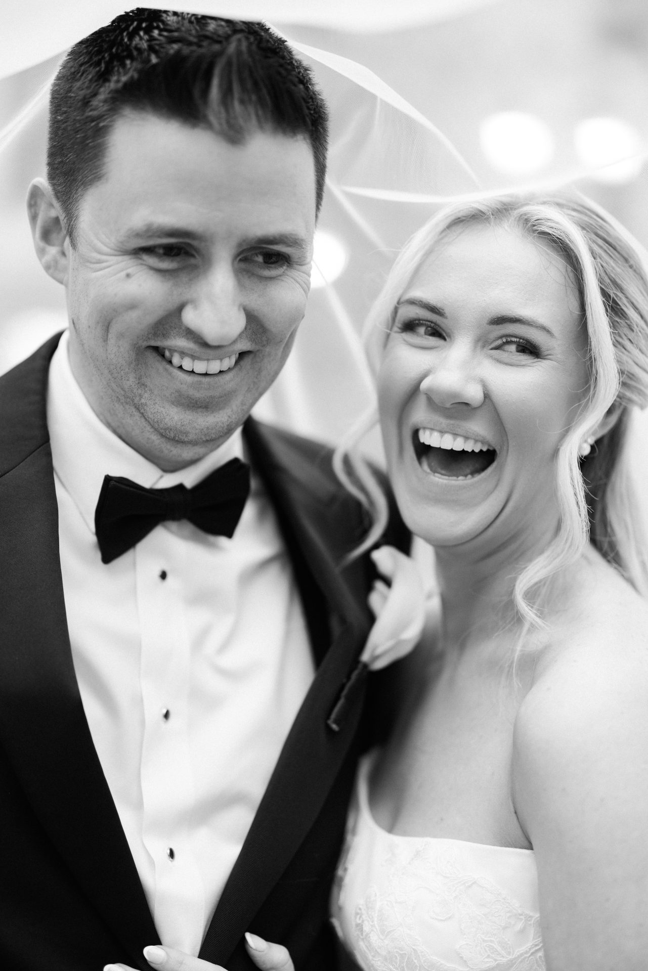 Bride and groom laughing close up candid portrait on wedding day Philadelphia