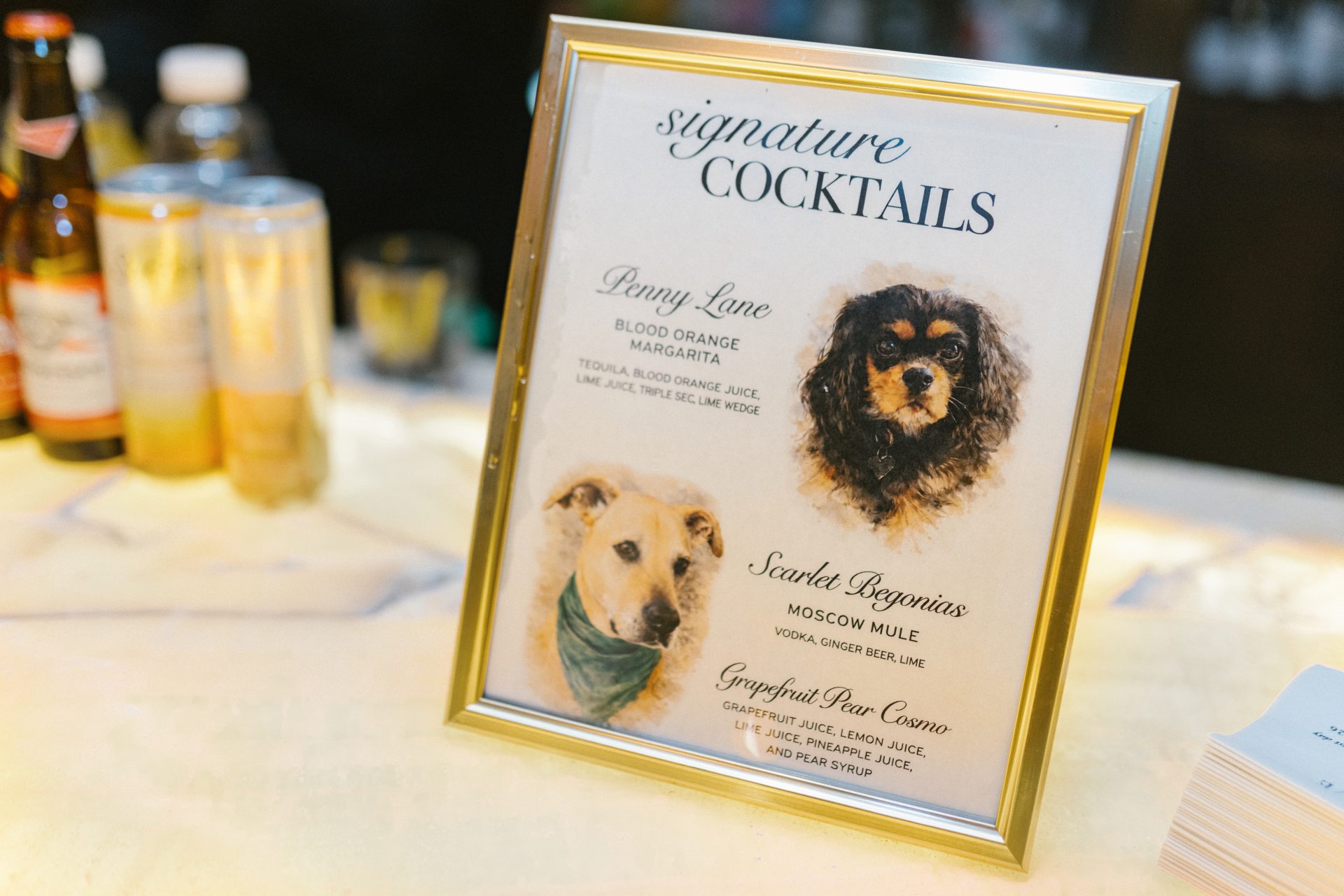 Signature cocktails sign with dog illustrations Penny Lane and Scarlet Begonias