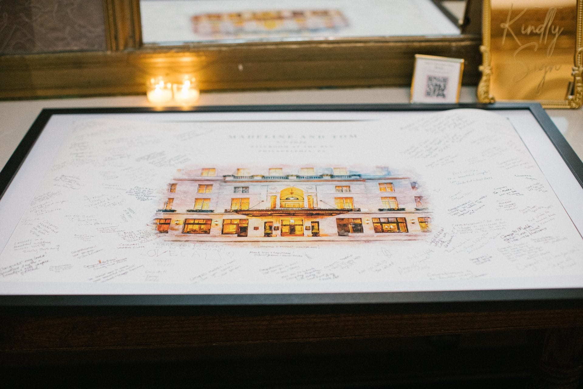 Watercolor venue painting guest book with signatures at Ballroom at the Ben wedding