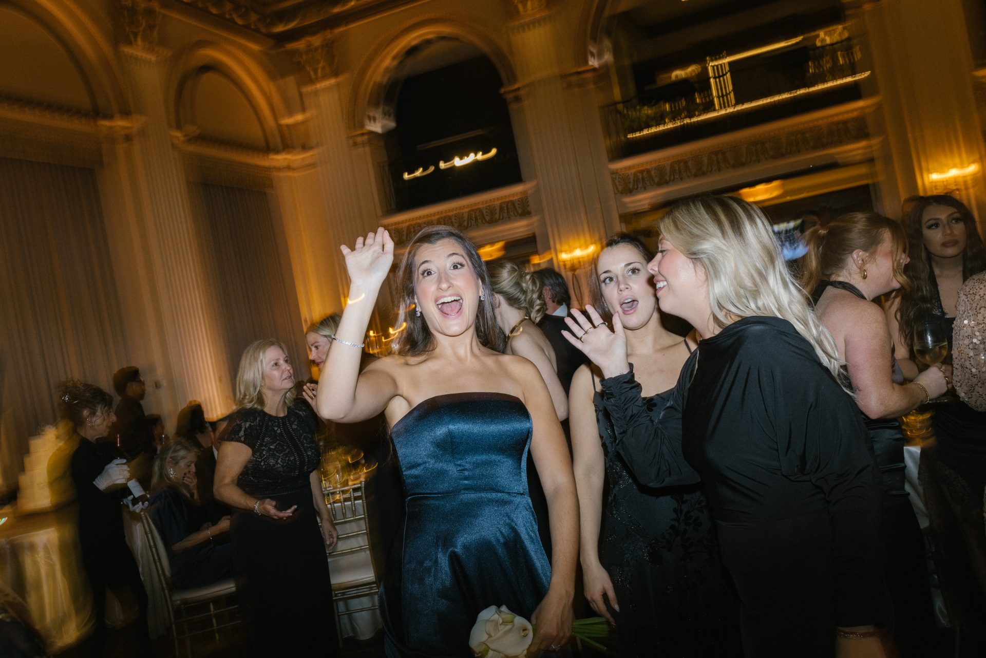 Bridesmaid celebrating on dance floor at Ballroom at the Ben wedding party