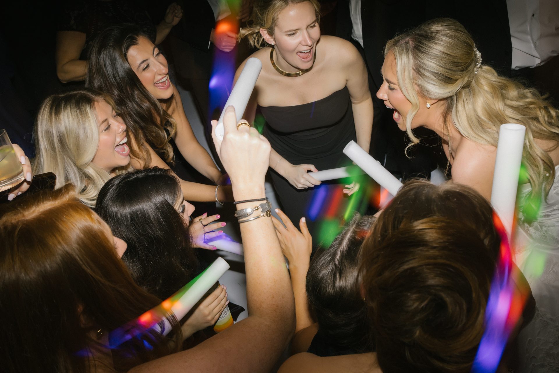 Dance floor party from above with LED foam glow sticks at Ballroom at the Ben