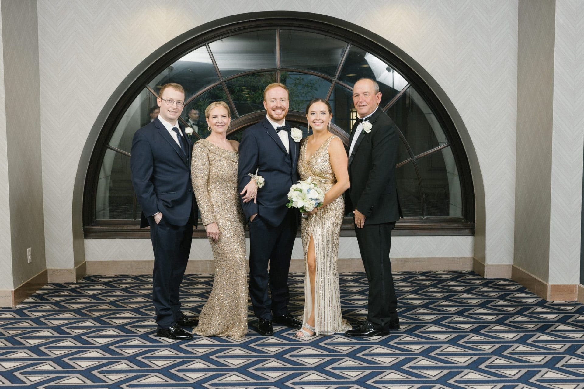 Family portraits in the Notary Hotel half-moon windows