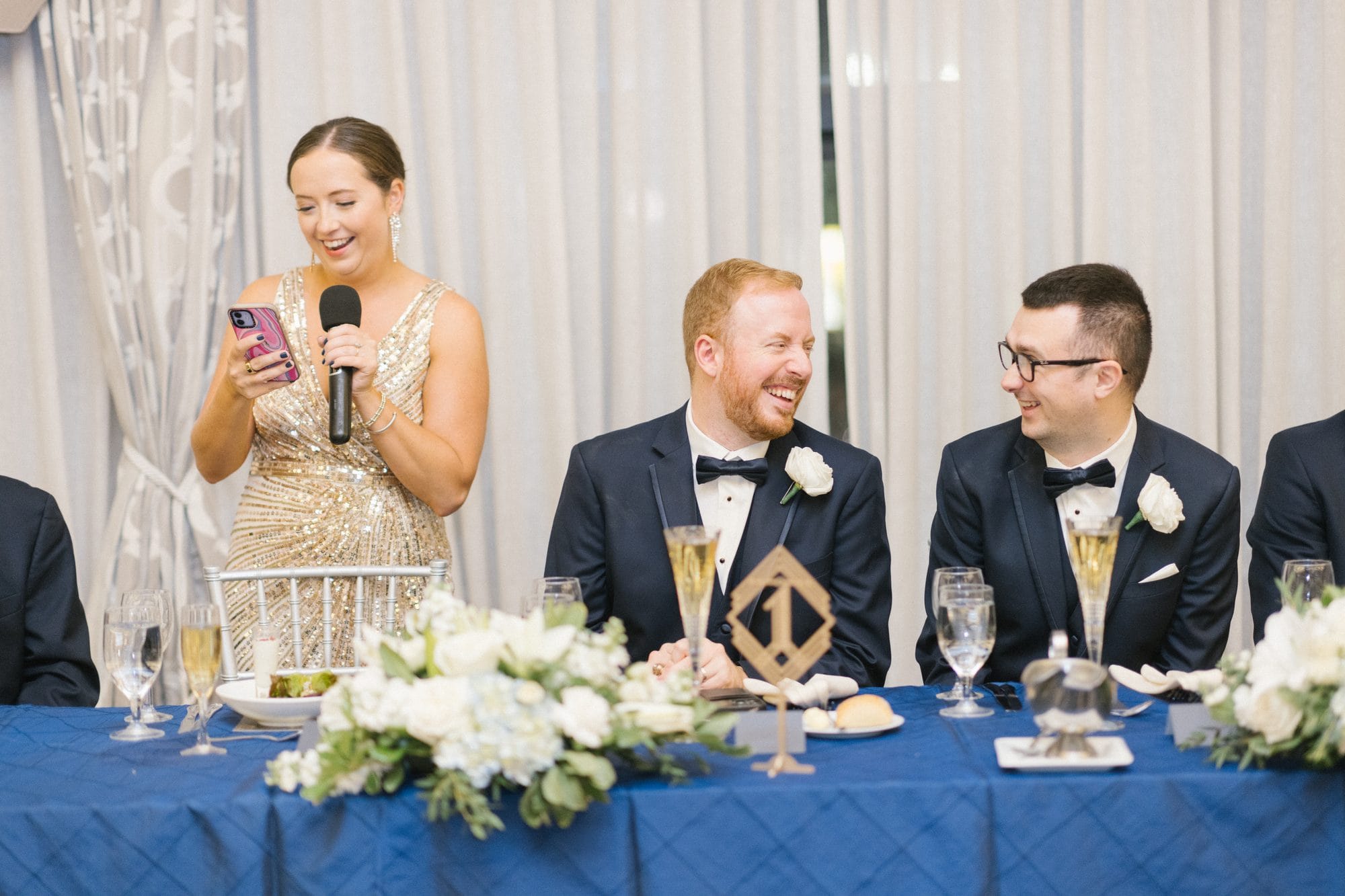Toasts at the head table during a wedding reception at The Notary Hotel Philadelphia