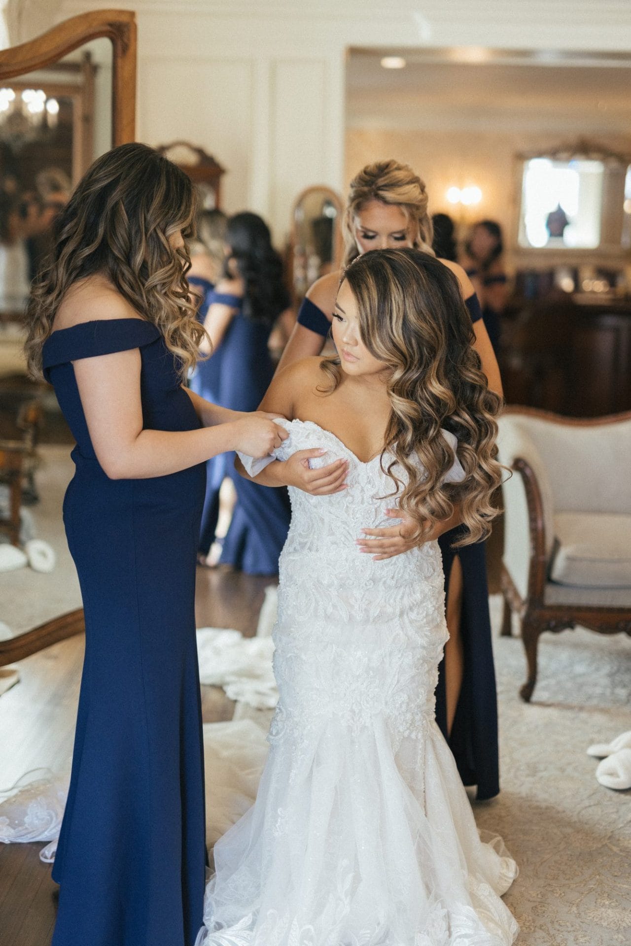 Chelsea laughing with her bridesmaids before the ceremony