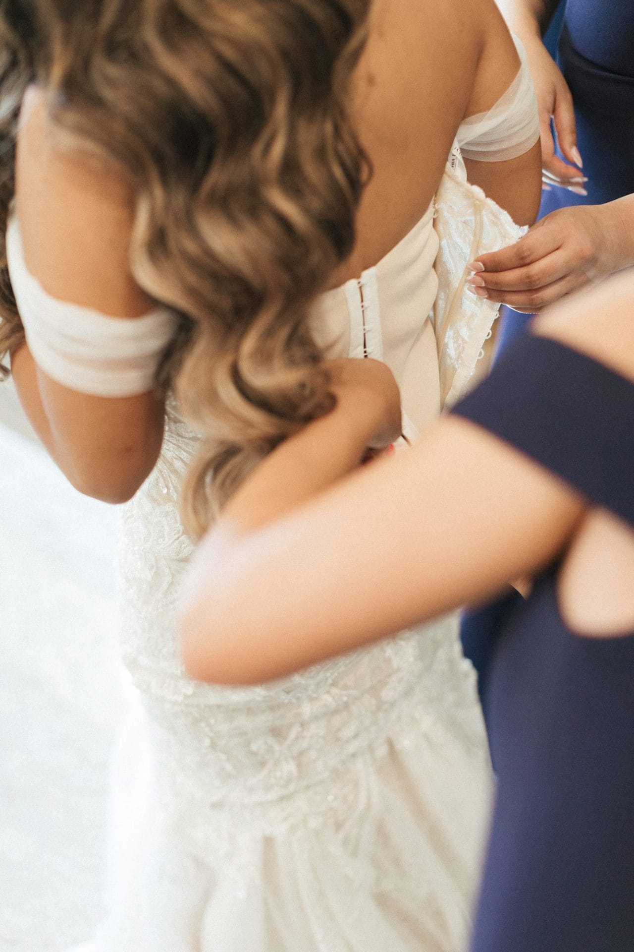 Chelsea getting into her wedding dress at Park Savoy