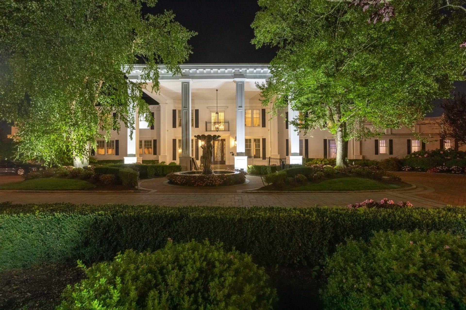 Exterior of Park Savoy Estate glowing during a wedding reception