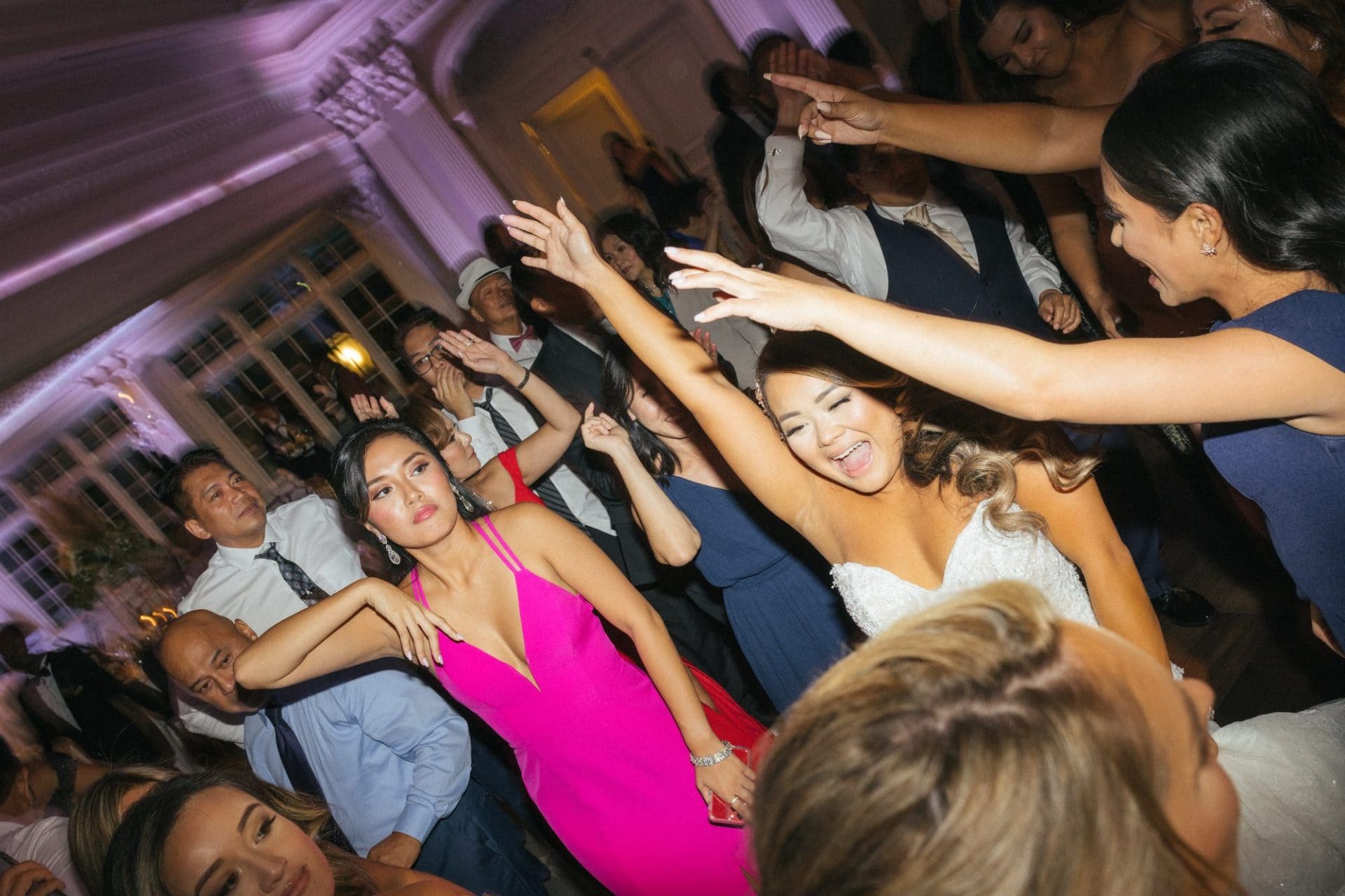 Chelsea dancing with her family at the reception