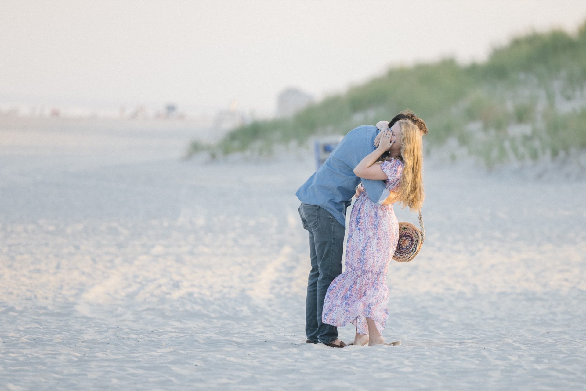 Champagne celebration on the beach at sunset after surprise proposal at ICONA Avalon
