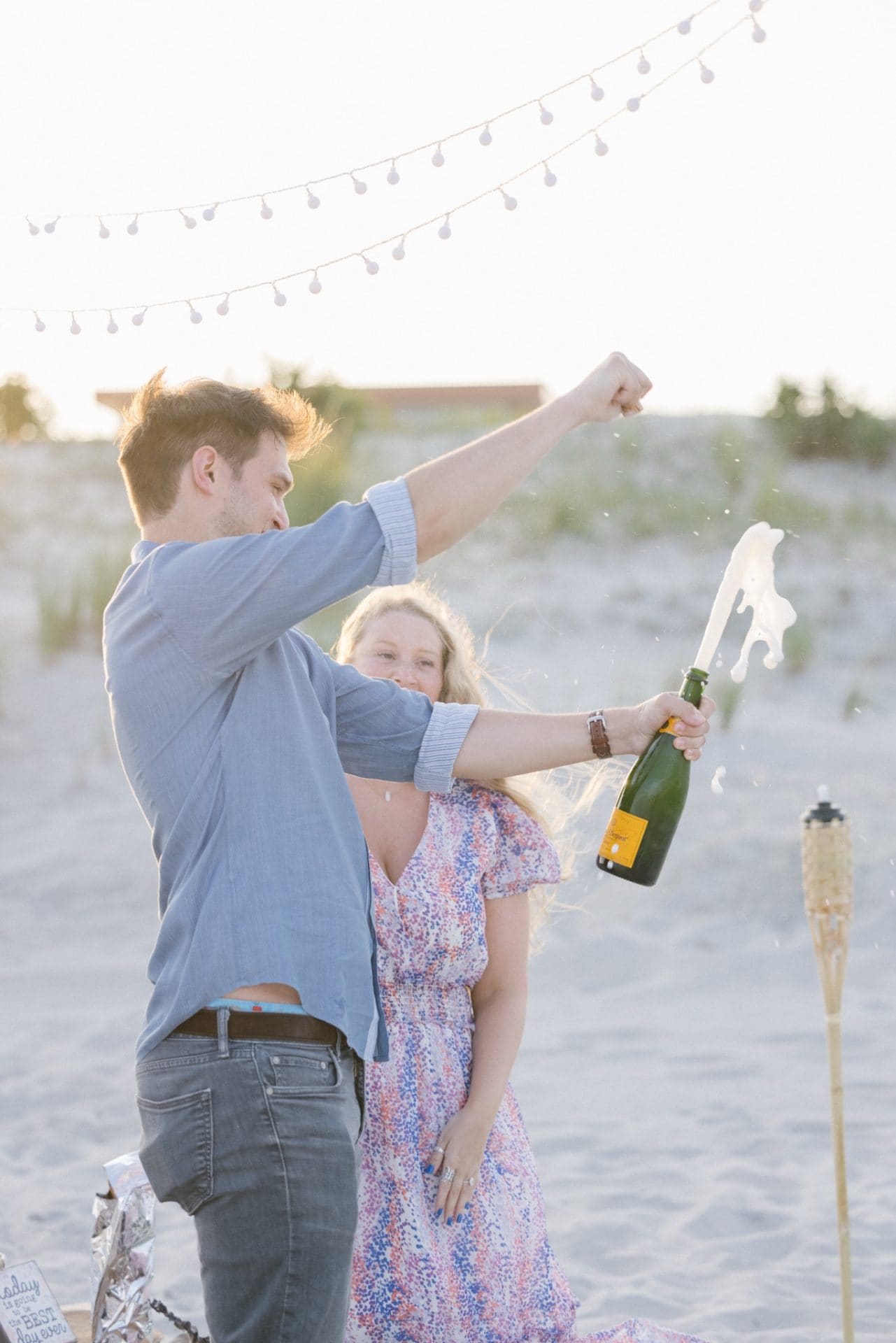 Sunset portrait of newly engaged couple at ICONA Avalon beach on the Jersey Shore