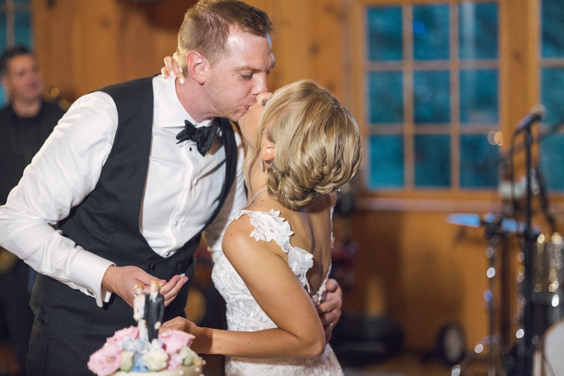 Couple cutting the cake at a barn reception, South Jersey wedding photography