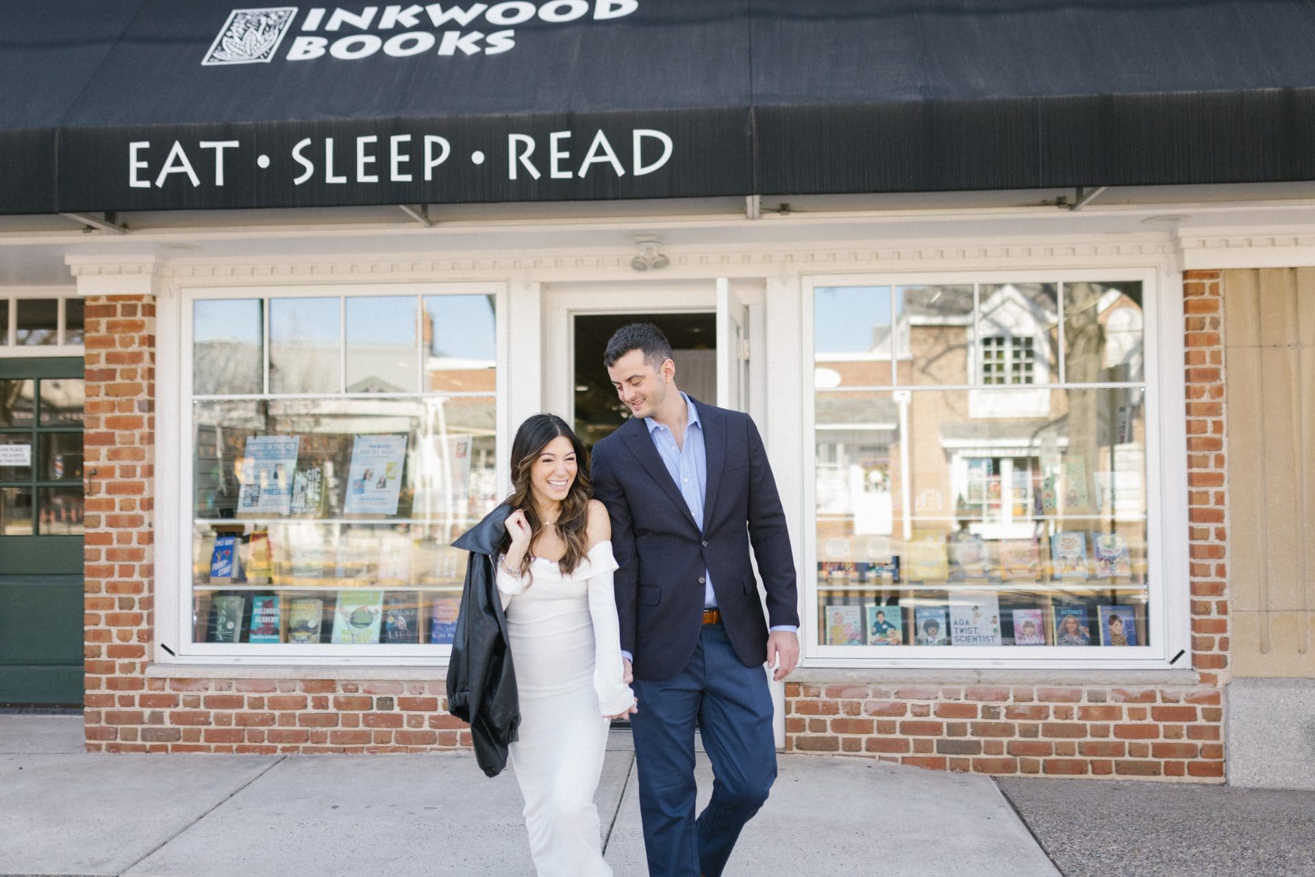 Family celebrating after surprise proposal at Inkwood Books bookstore in Haddonfield NJ South Jersey