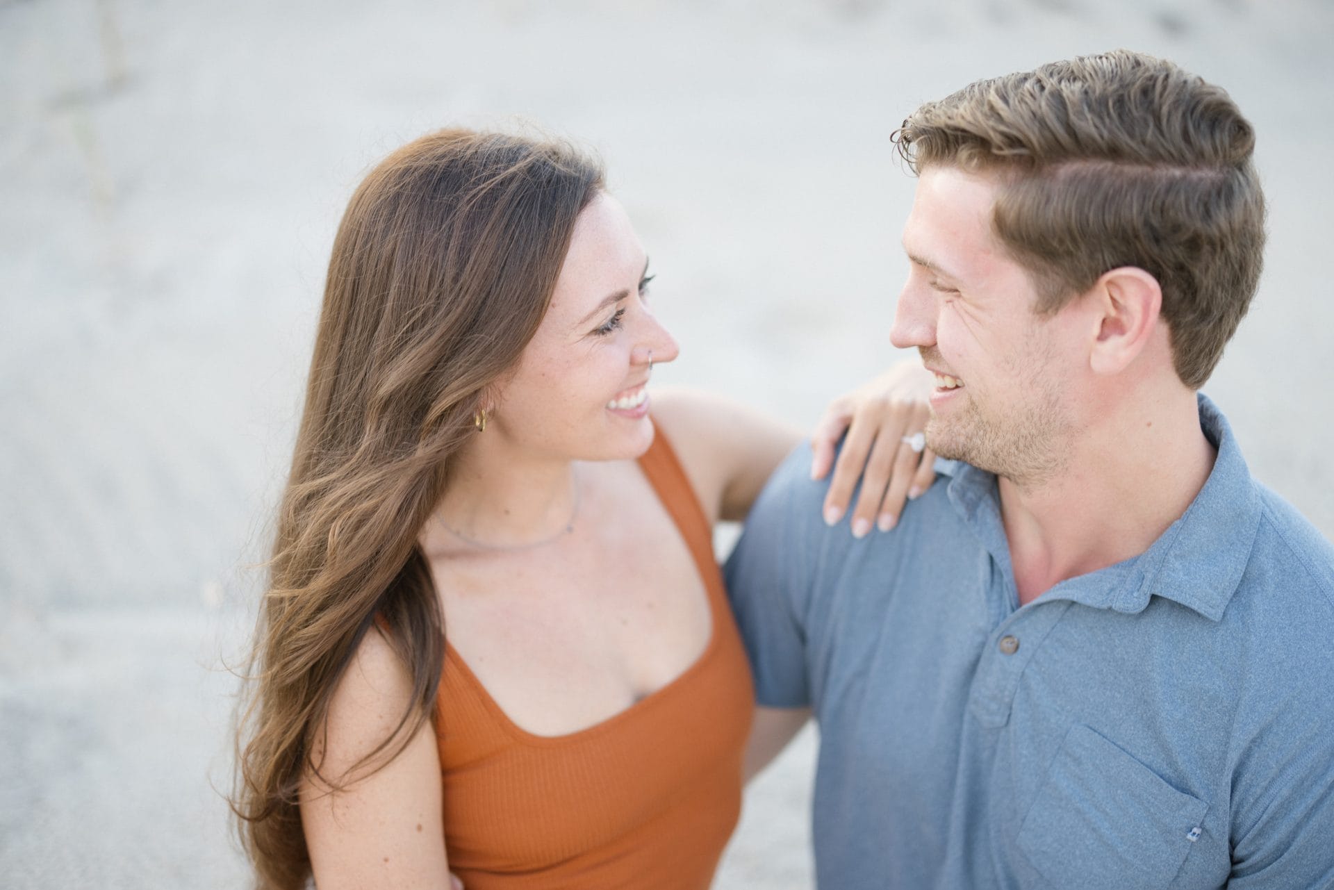 Close-up emotional moment during surprise proposal on Long Beach Island beach