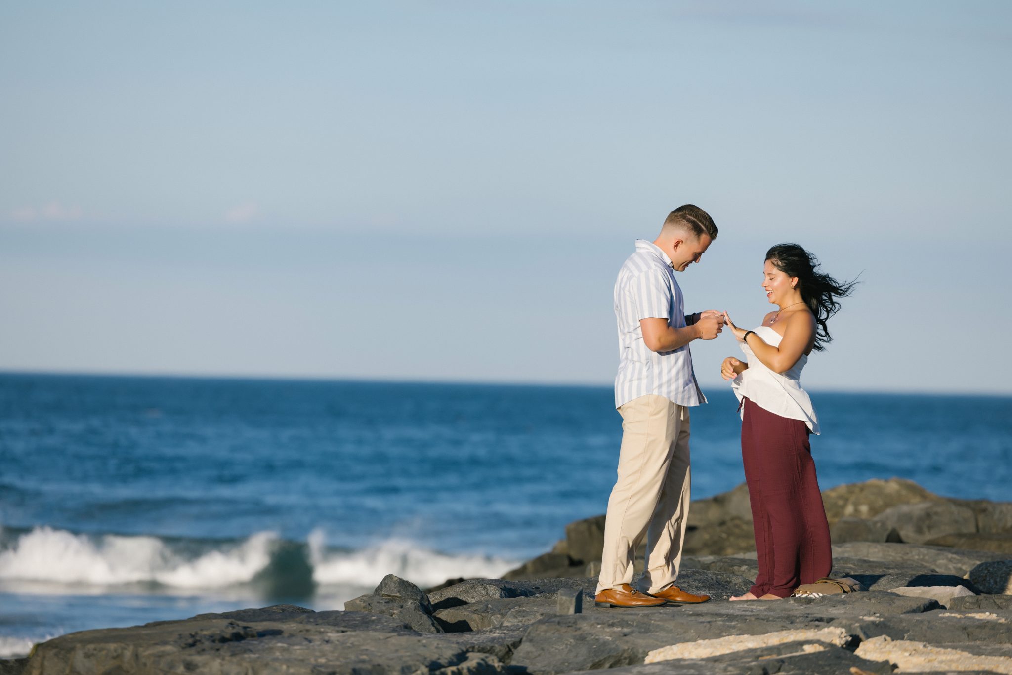 Ring reveal during a surprise proposal on an Asbury Park NJ jetty