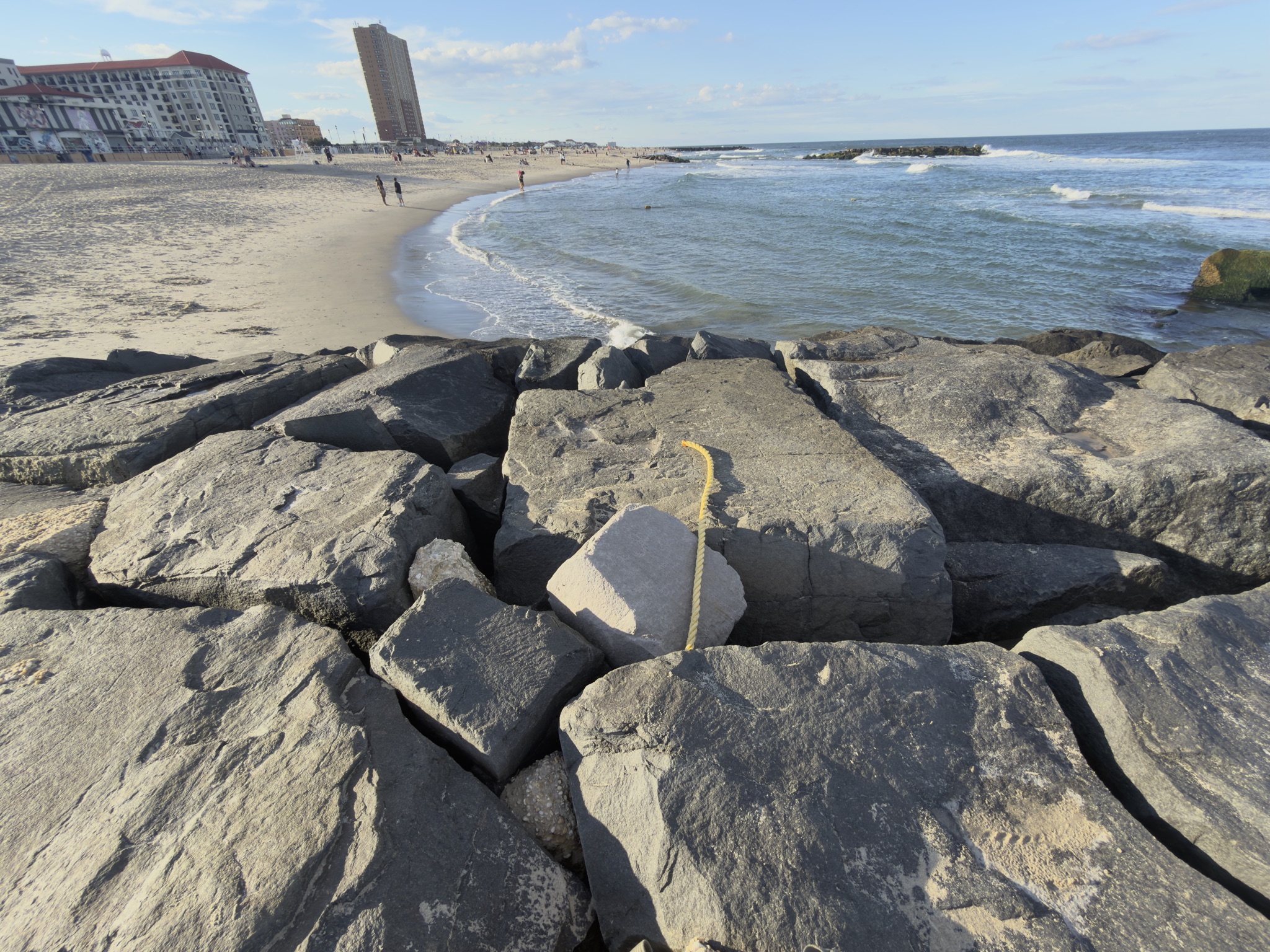 Yellow rope laid across a jetty rock to mark the spot and direction for the Asbury Park proposal