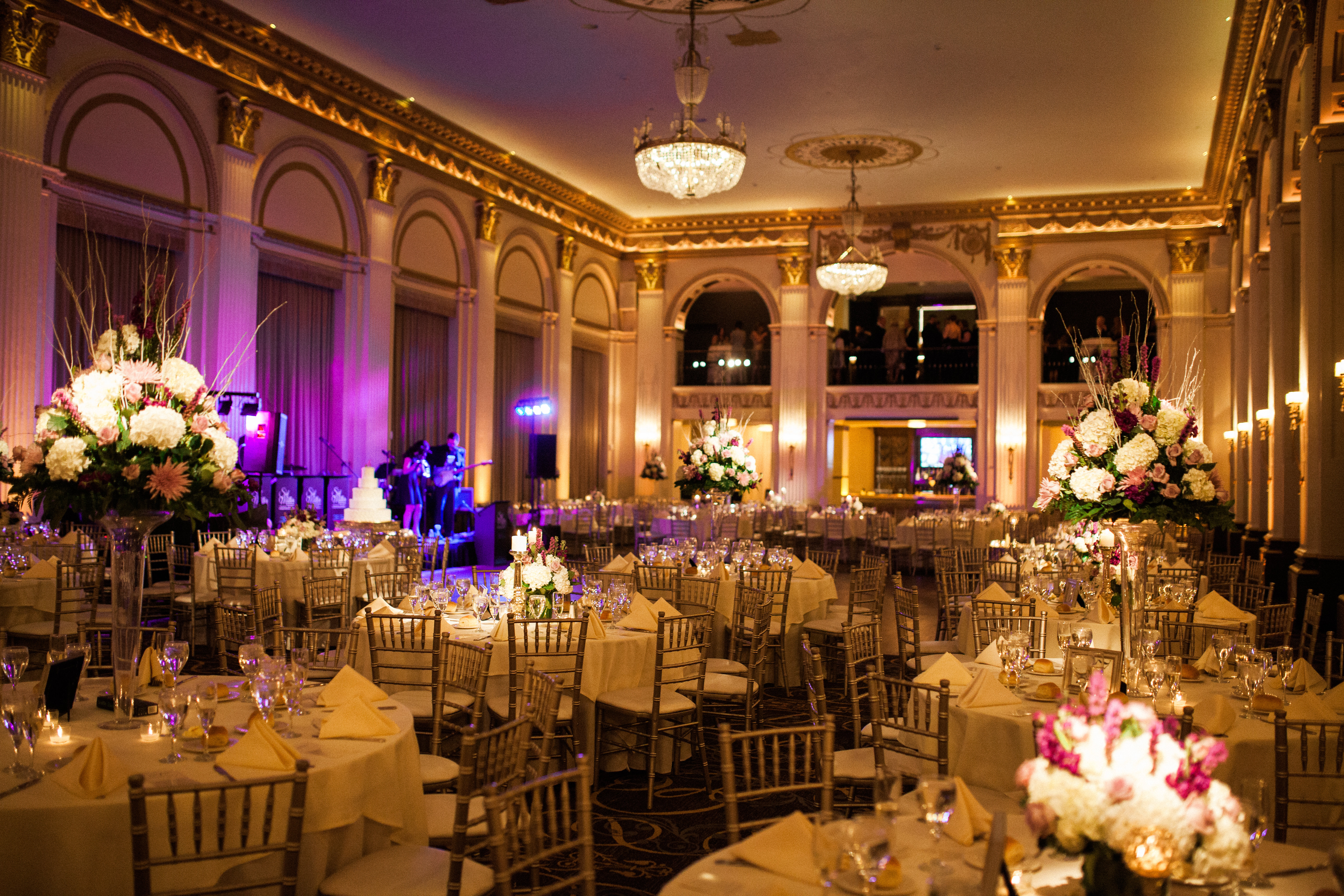 Pin spotting at the Ballroom at the Ben in Philadelphia, with tight spotlights on every centerpiece and the cake, photographed by Jordan Brian