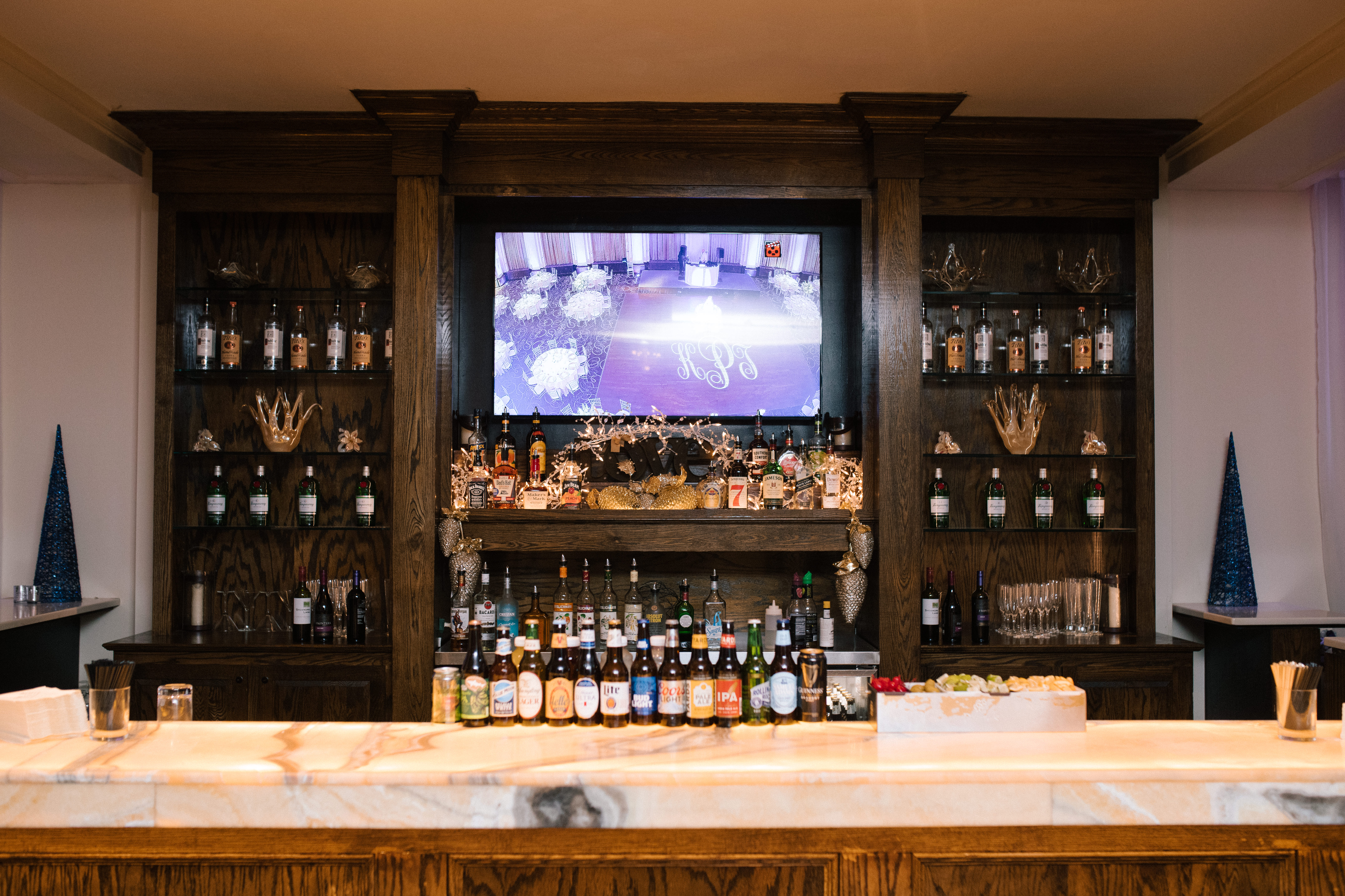 One of the recently upgraded bars at the Ballroom at the Ben in Philadelphia, with a marble counter and full back bar, photographed by Jordan Brian