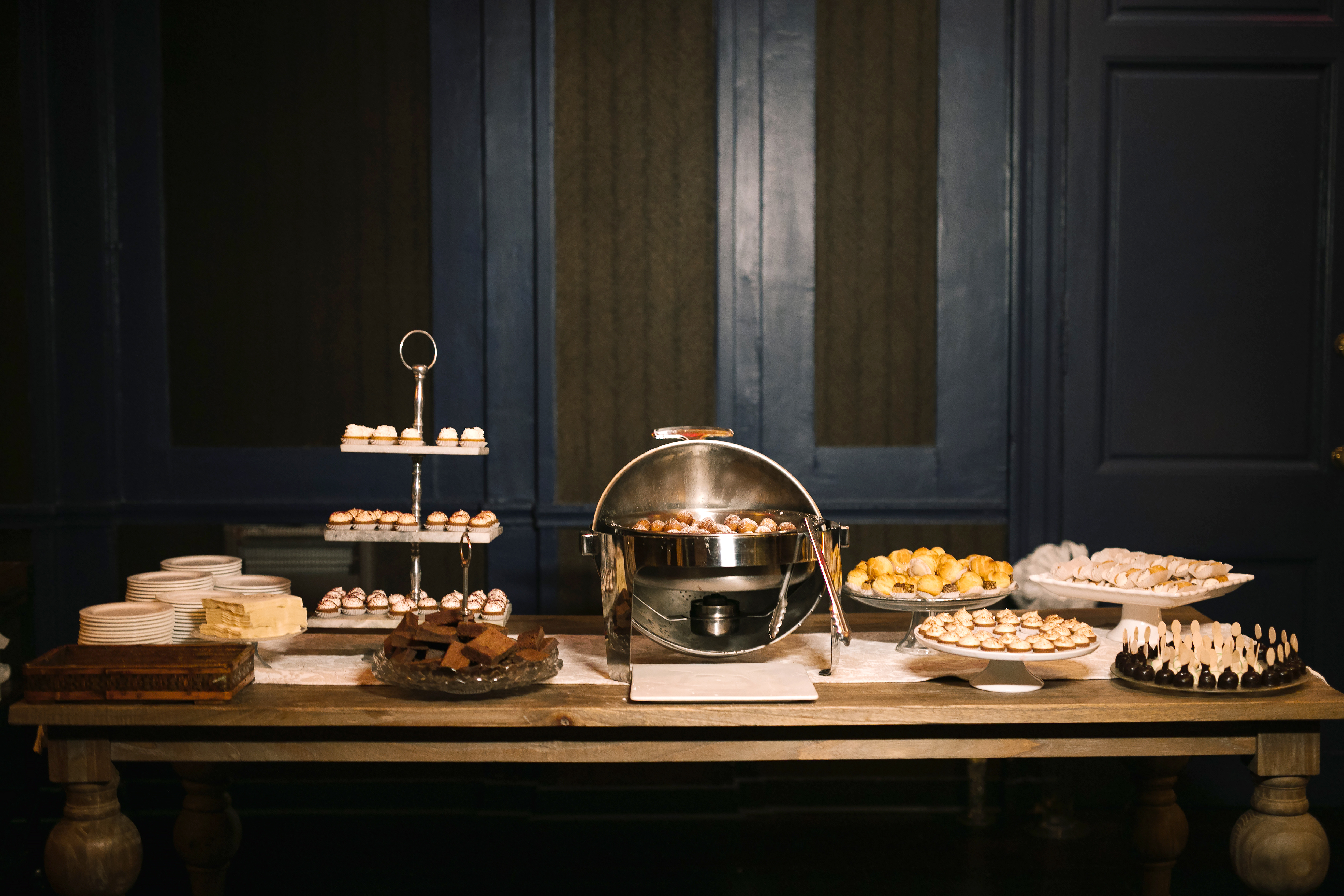 Dessert lounge spread with tiered pastries and sweets at the Ballroom at the Ben in Philadelphia, photographed by Jordan Brian