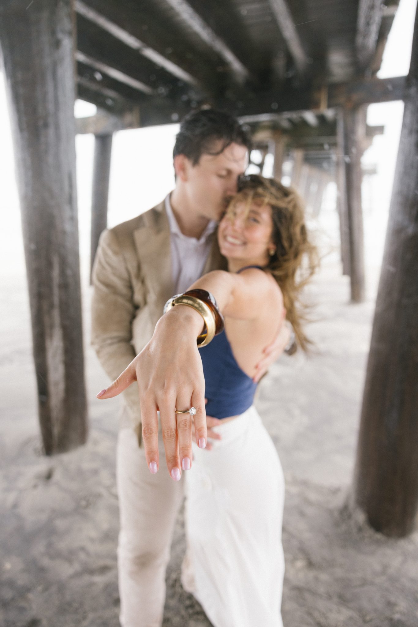 Engagement portrait under the fishing pier in Ocean City NJ