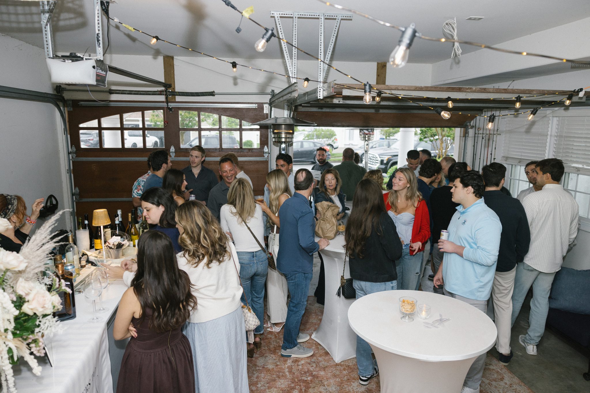 Guests mingling at a surprise engagement party in Ocean City NJ