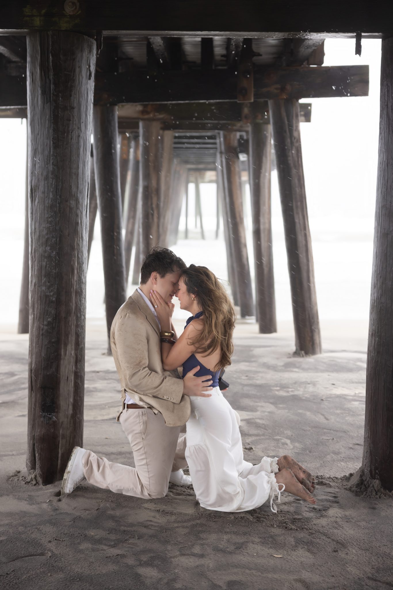 Couple hugging after a surprise proposal in Ocean City NJ