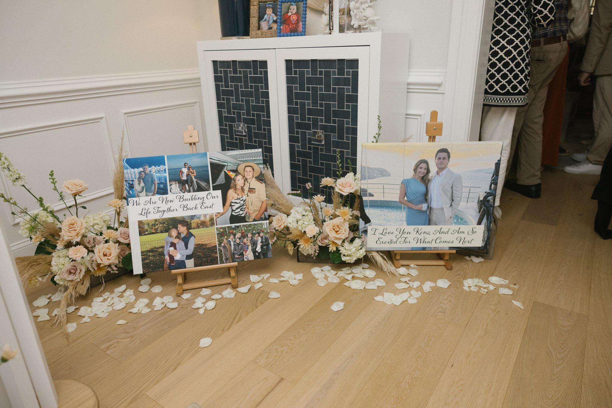 Photo display and flower petals at the engagement party