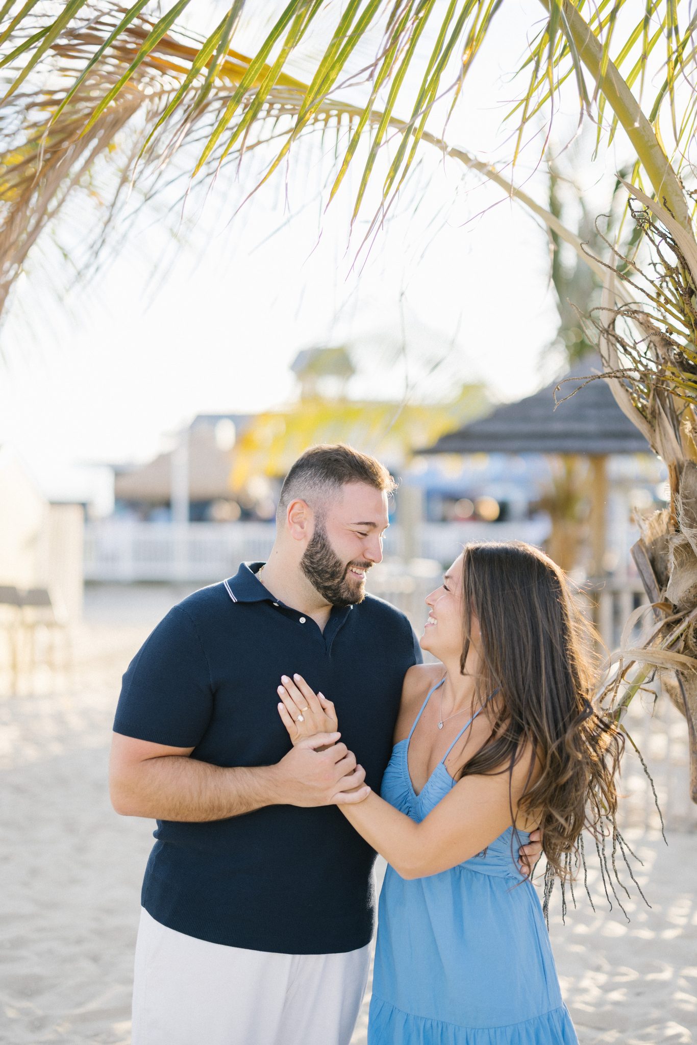 Anthony and Juliette under the palm trees by Jenkinson's in Point Pleasant Beach NJ