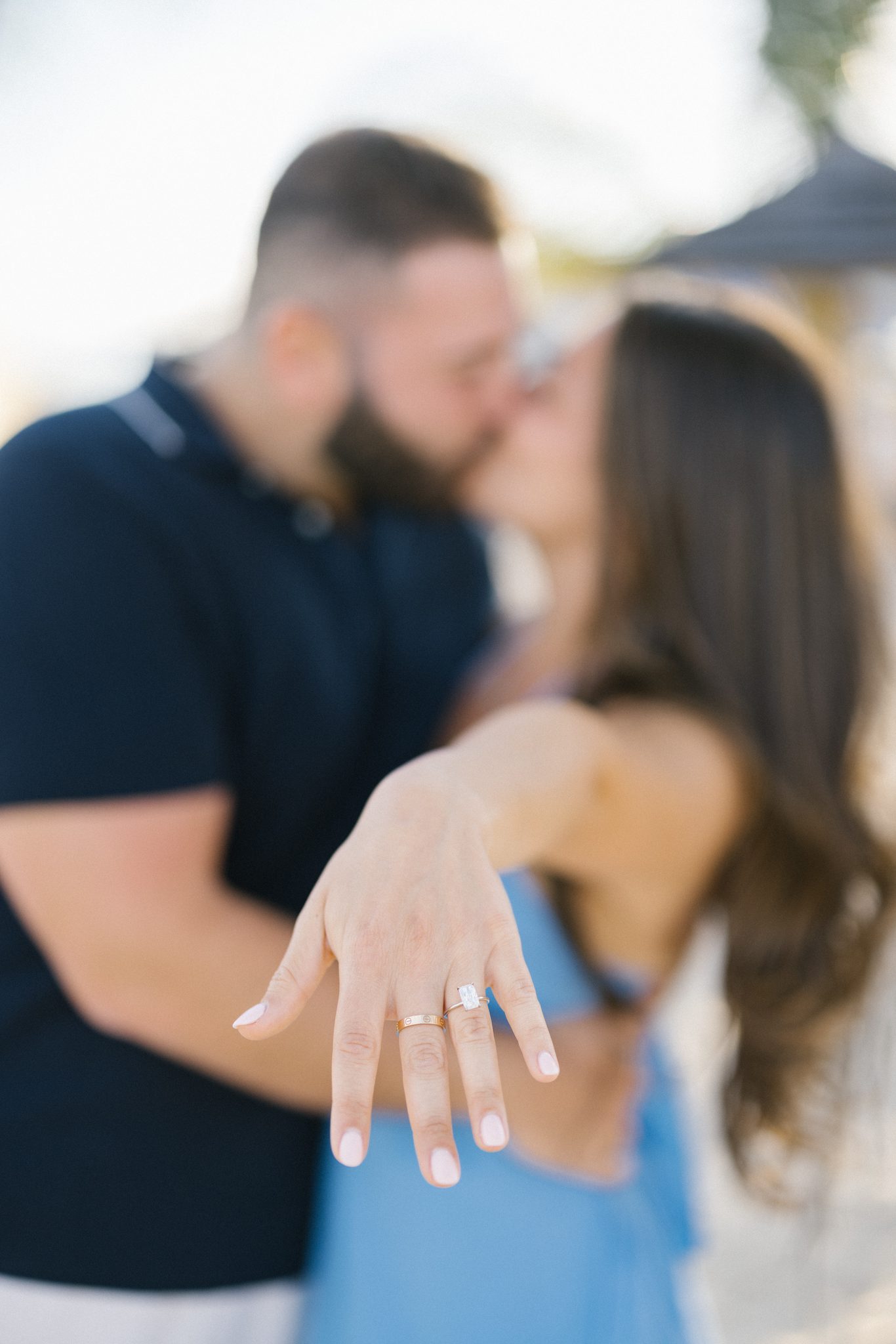 Juliette showing off her engagement ring under the palm trees at Jenkinson's in Point Pleasant Beach NJ