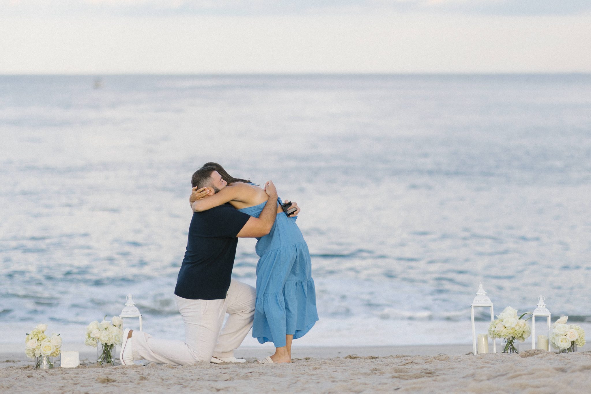 Anthony and Juliette hugging after she said yes on the beach in Point Pleasant Beach NJ