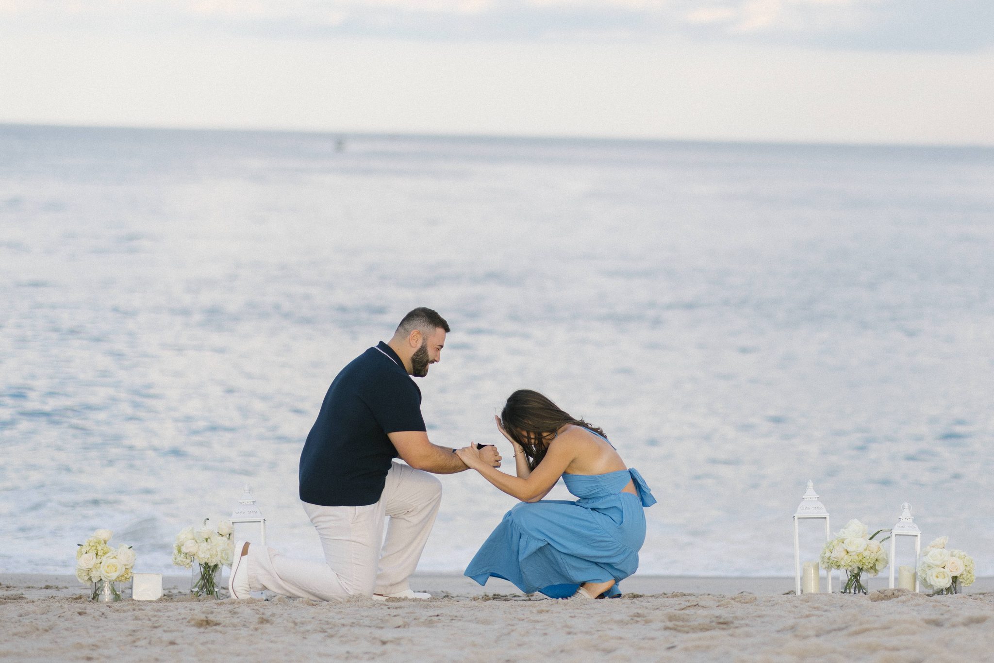 Anthony proposing to Juliette on the beach by the jetty in Point Pleasant Beach NJ