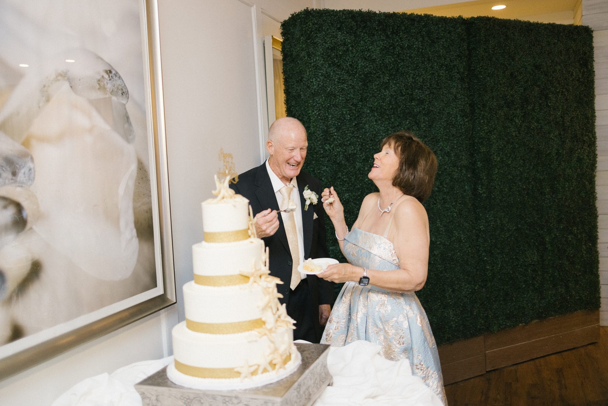 Stu and Betsy laughing during the cake cutting at their 50th anniversary celebration in Avalon, New Jersey