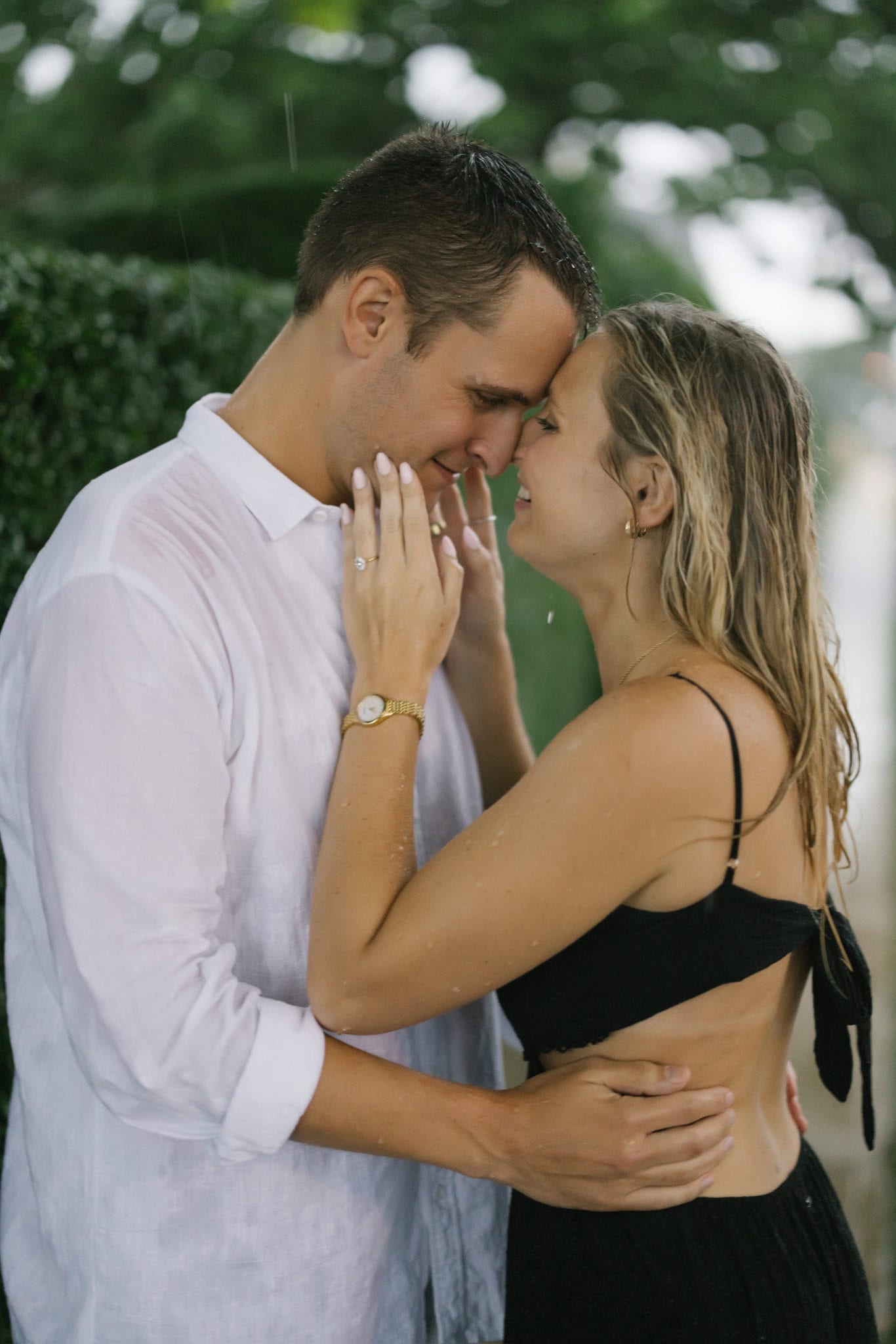Couple forehead to forehead in a tender portrait after their Bay Head NJ engagement