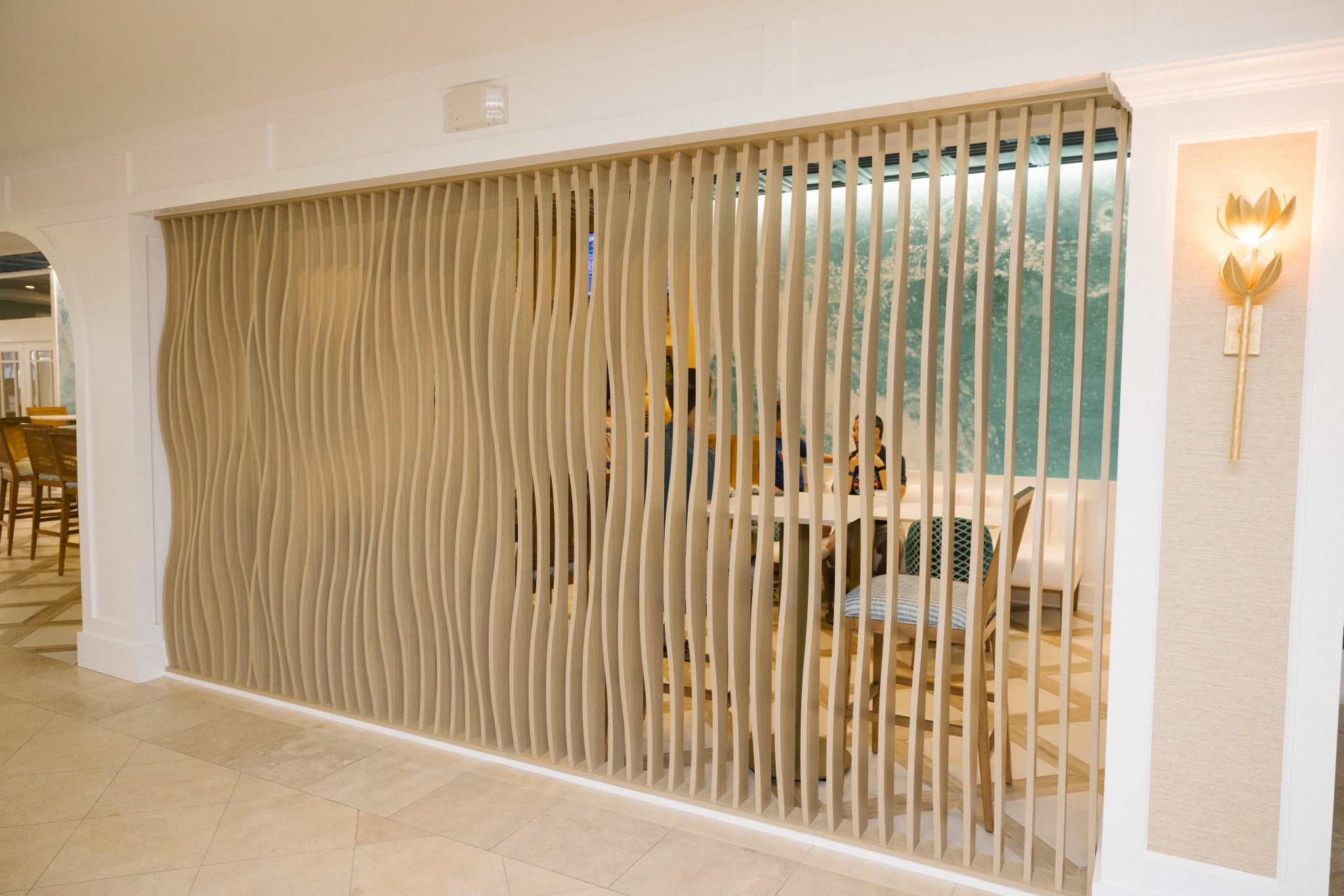 Sculpted wave-slat partition detail in the renovated bar area at ICONA Avalon in Avalon NJ